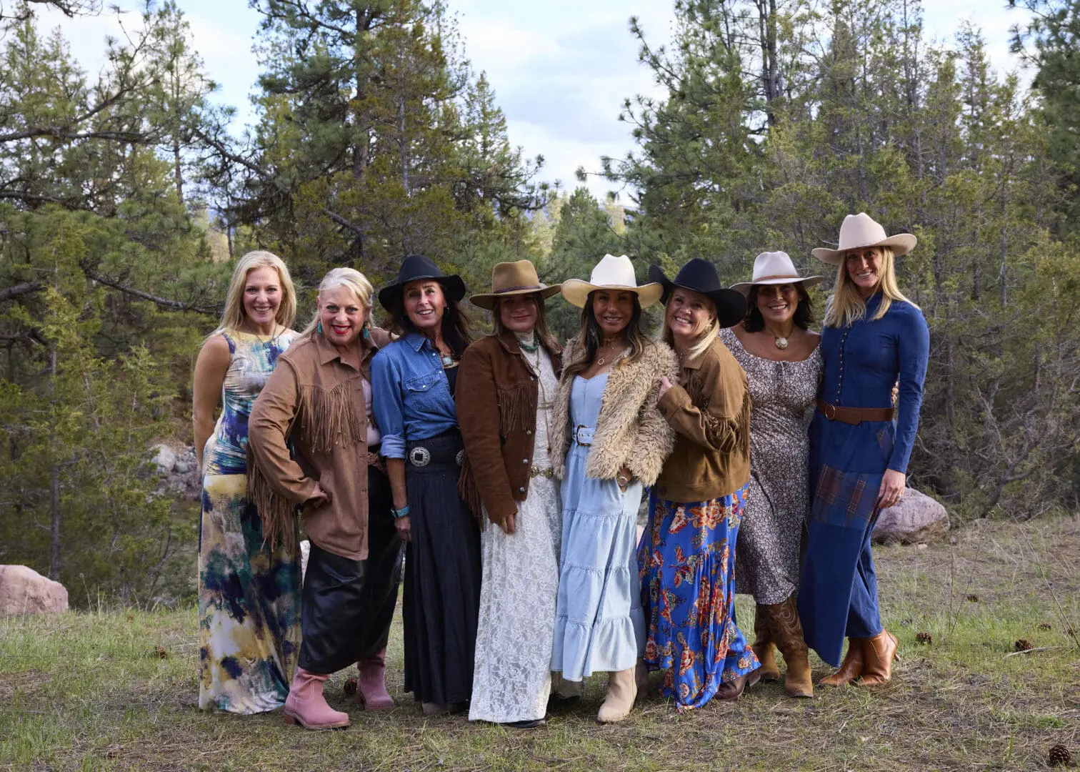 Group of women wearing western style clothes posing together.