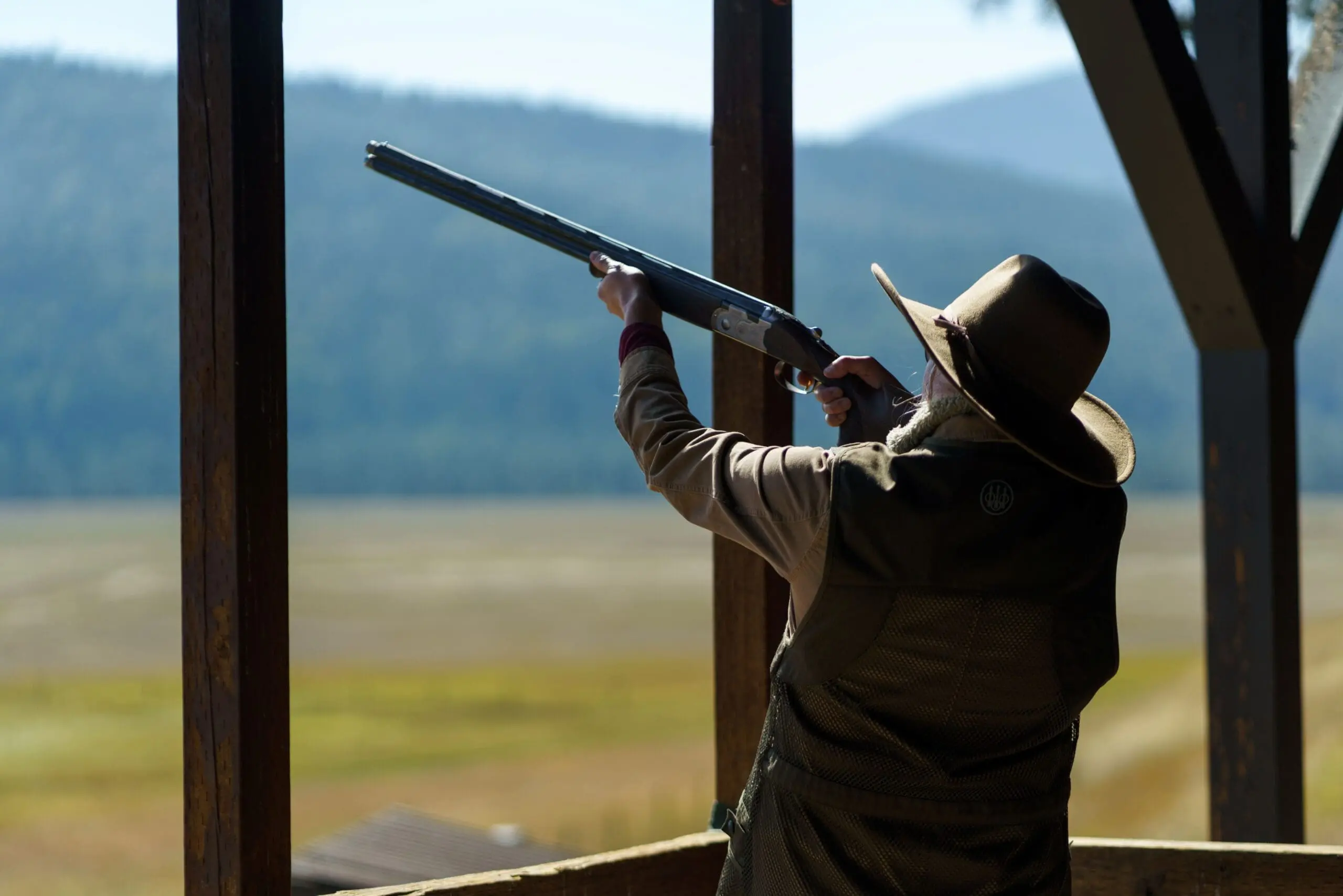 Cowboy shooting a rifle for sporting clays activity