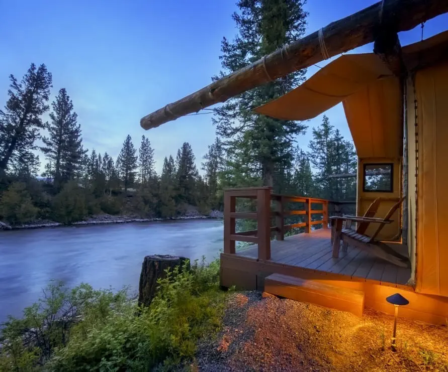 Side shot of a glamping tent balcony along the Blackfoot River
