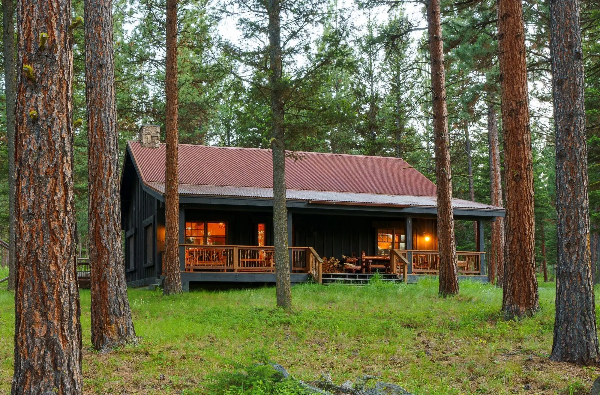 Exterior of a wooden cabin with a balcony