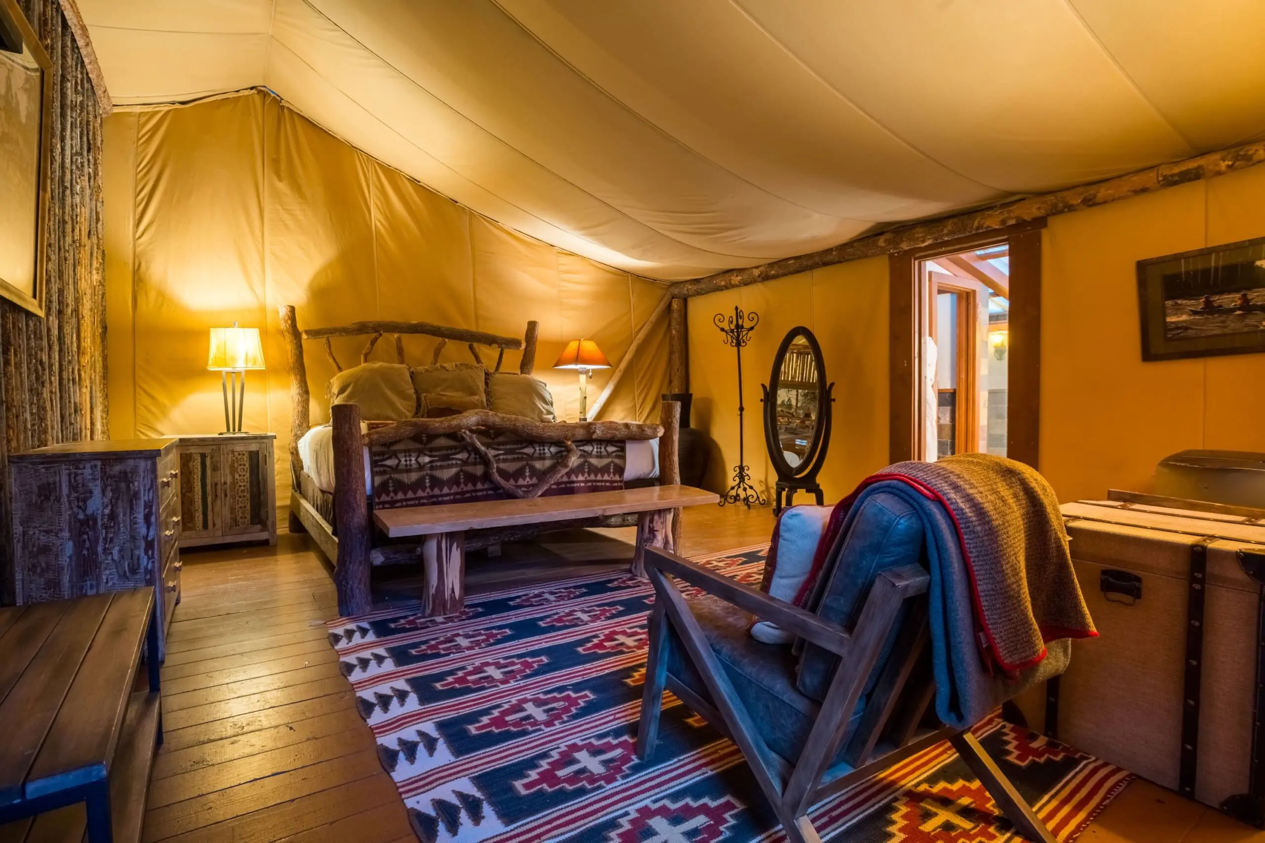 Interior of two bedroom glamping tent with king size bed