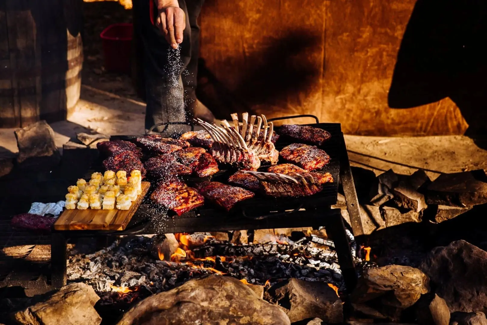 Ribs and meat cooking over an open flame