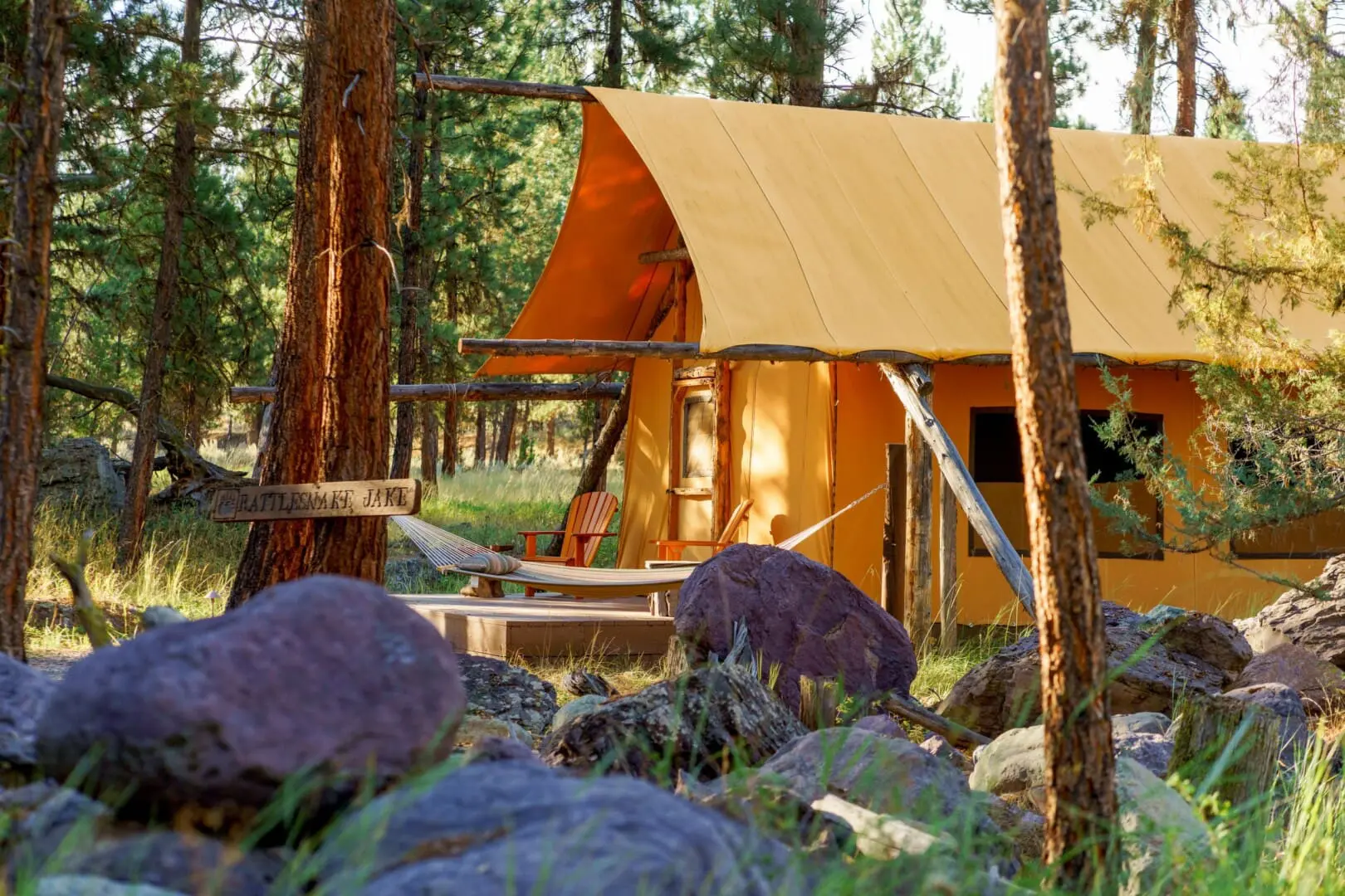 Outside of canvas glamping tent in the woods