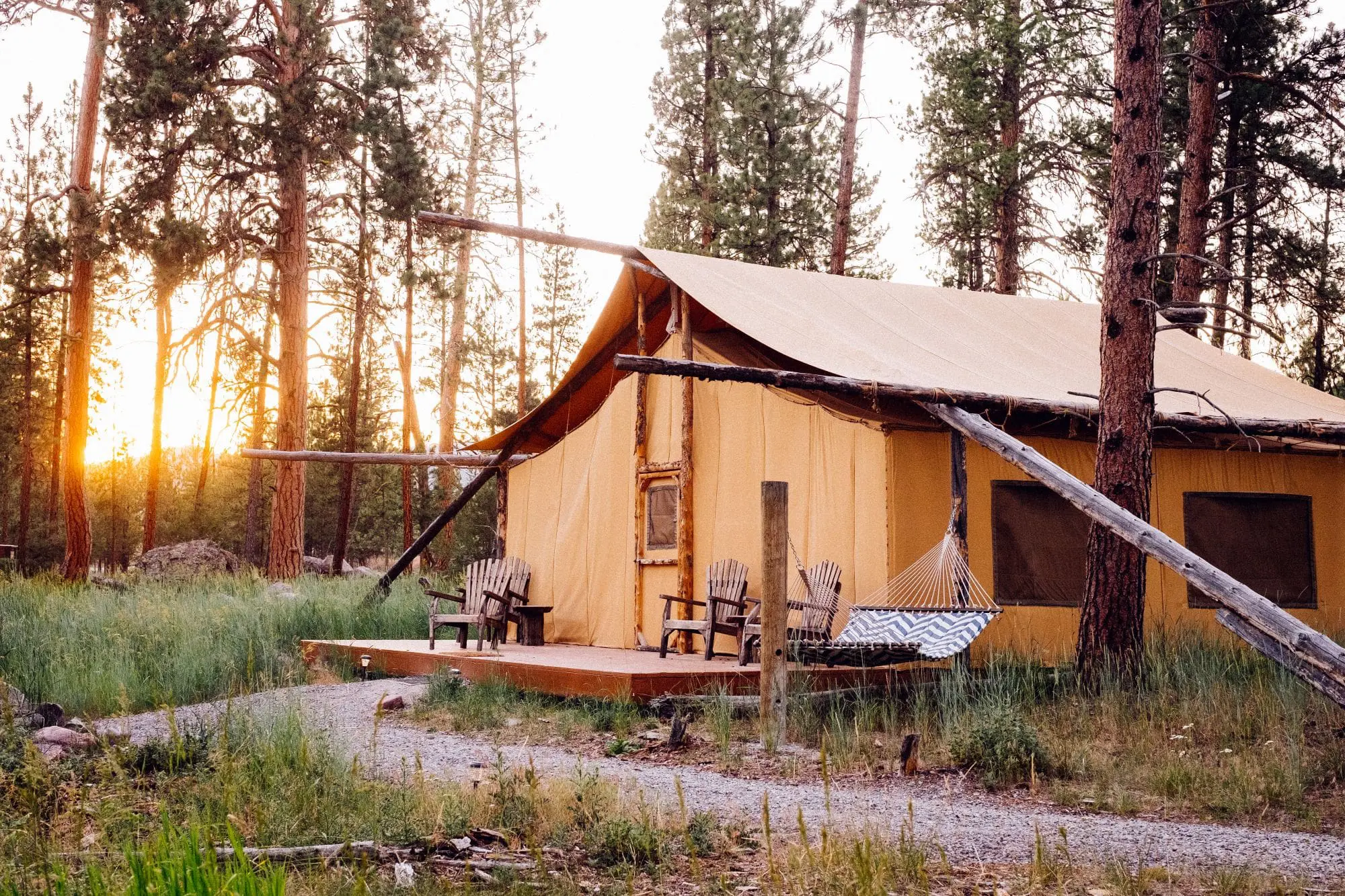 Exterior of a two bedroom glamping canvas tent in the forest