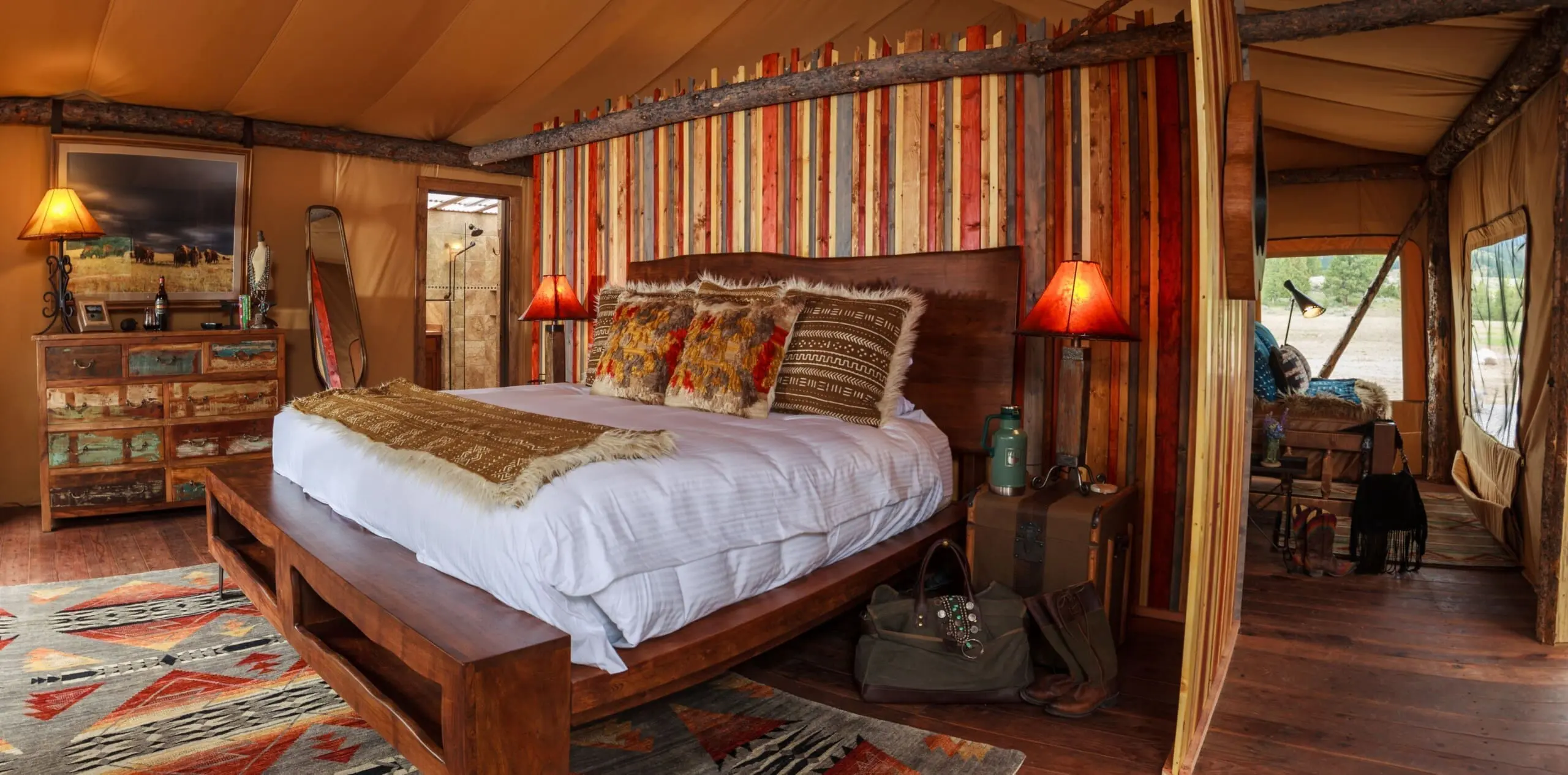 Western style luxury bedroom with king size bed inside glamping tent