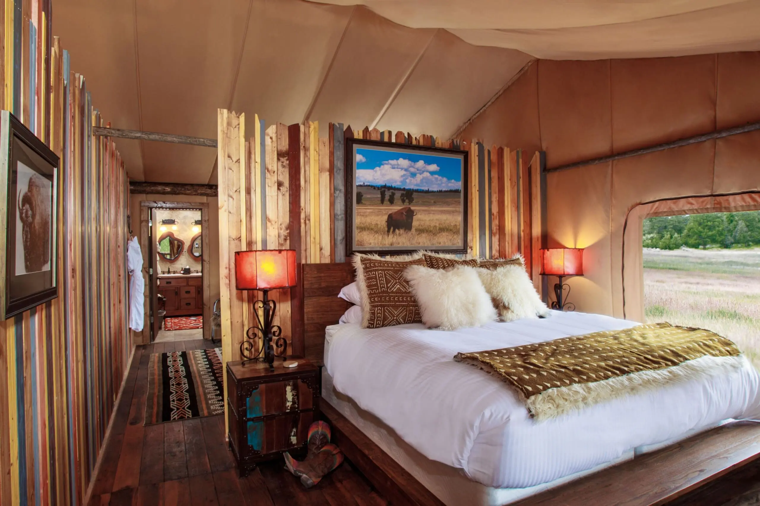 King size bed inside canvas glamping tent