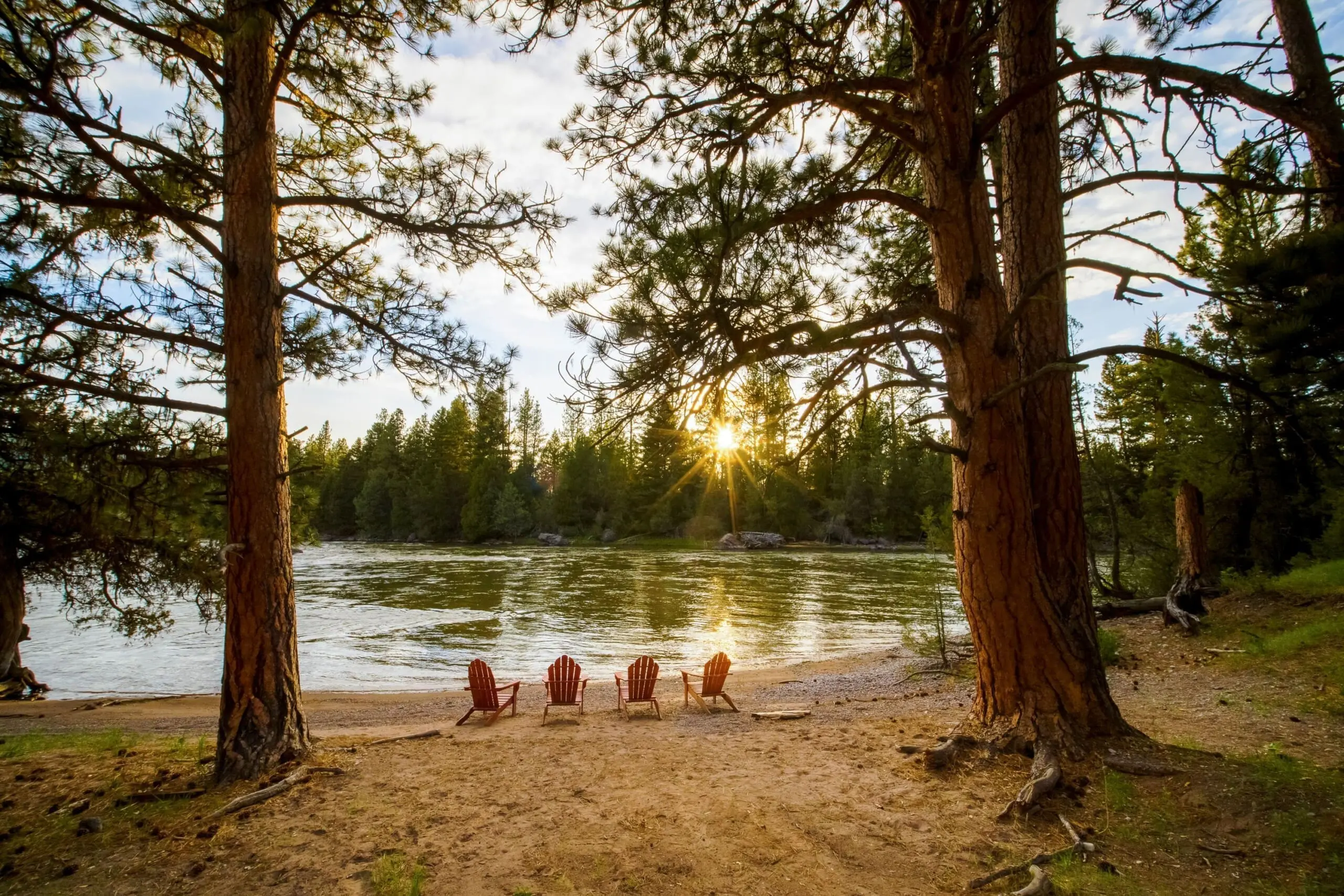 Chairs sitting on a river beach