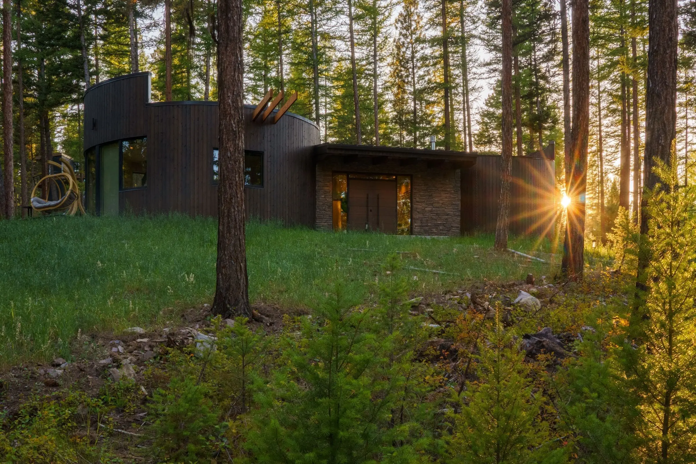 Exterior of round cabin in the woods