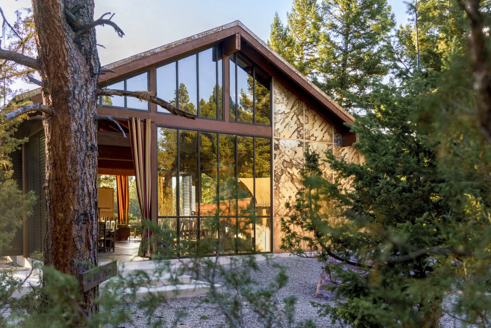 Cliffside glamping spot featuring a glass home.