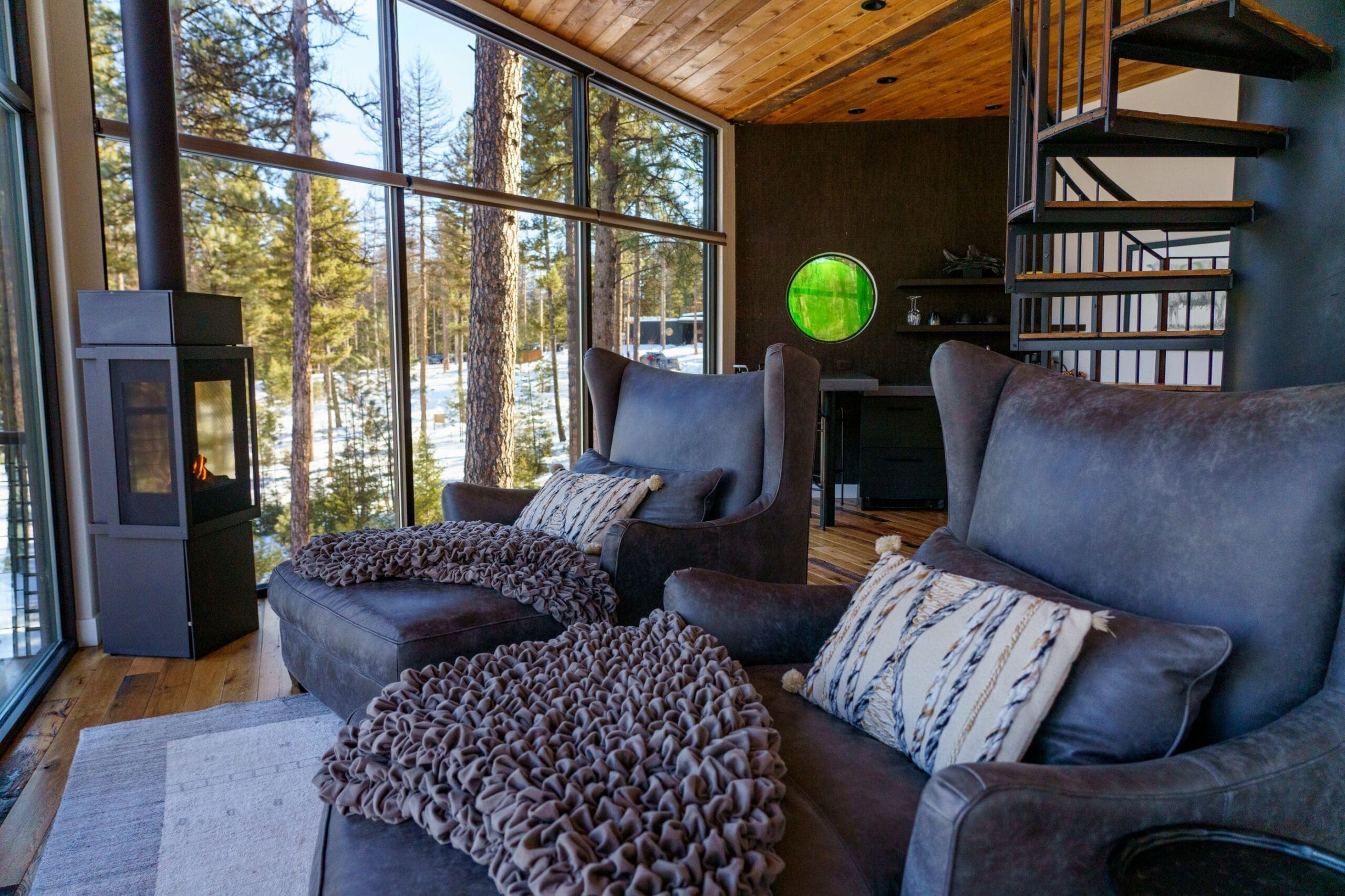 Leather lounge chairs inside a treehouse living room