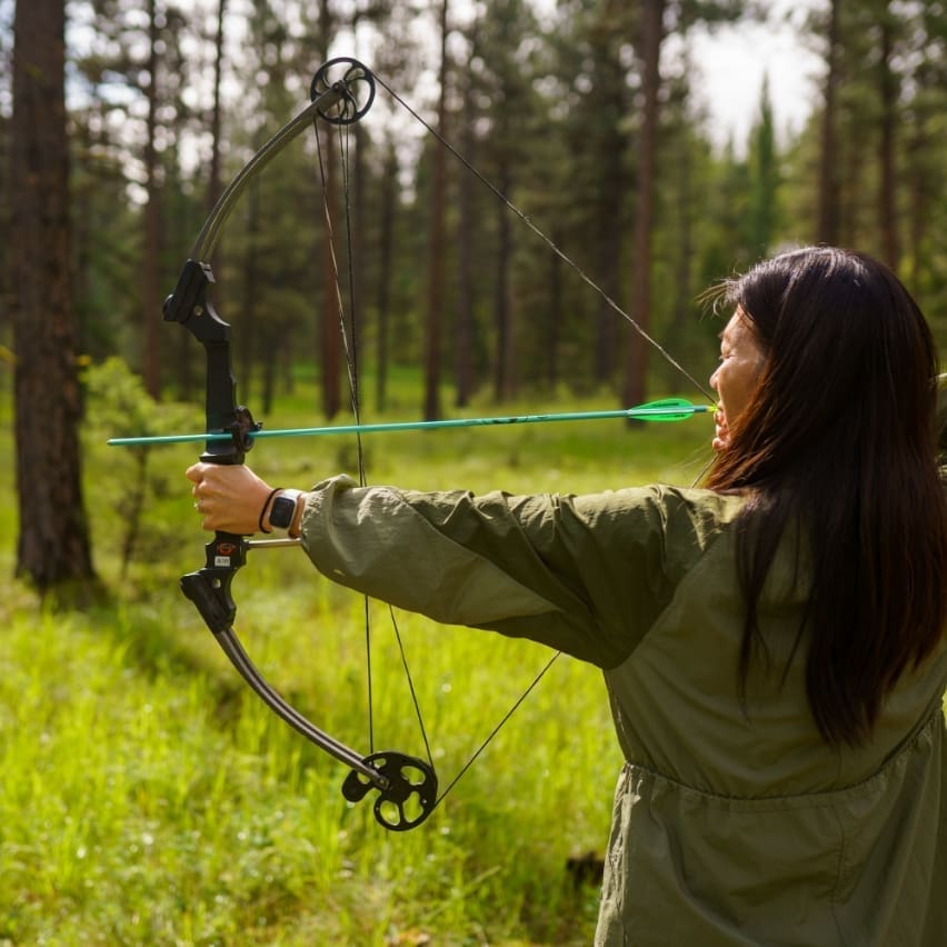 Woman aiming a bow and arrow
