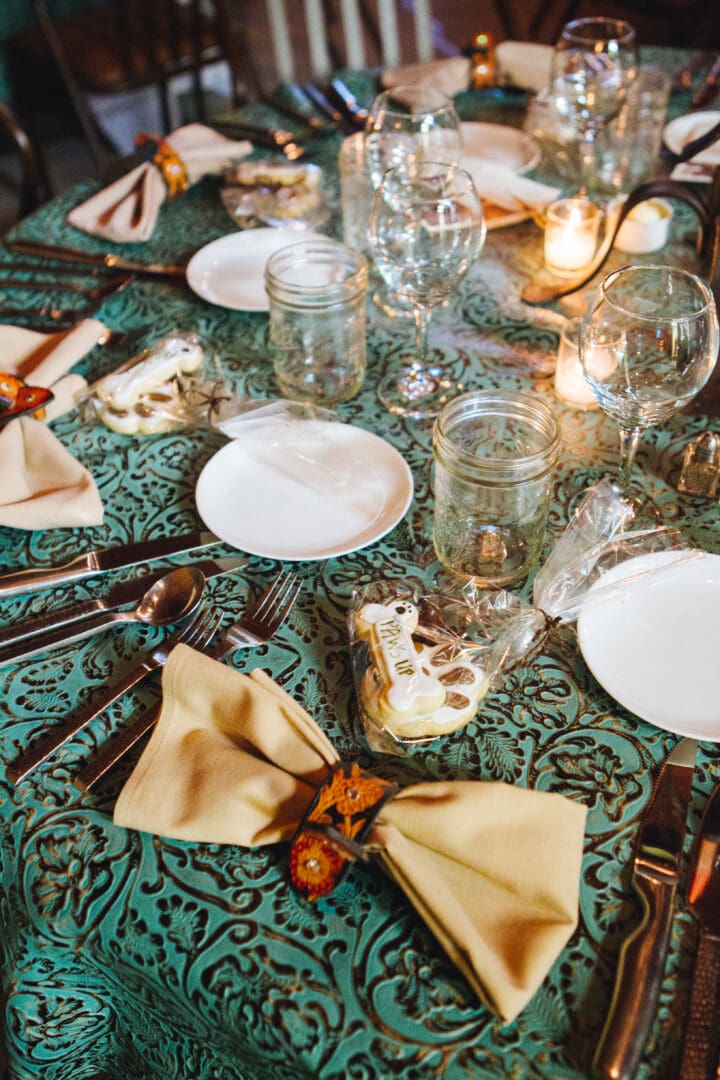 Western dinner table set with dog treats.
