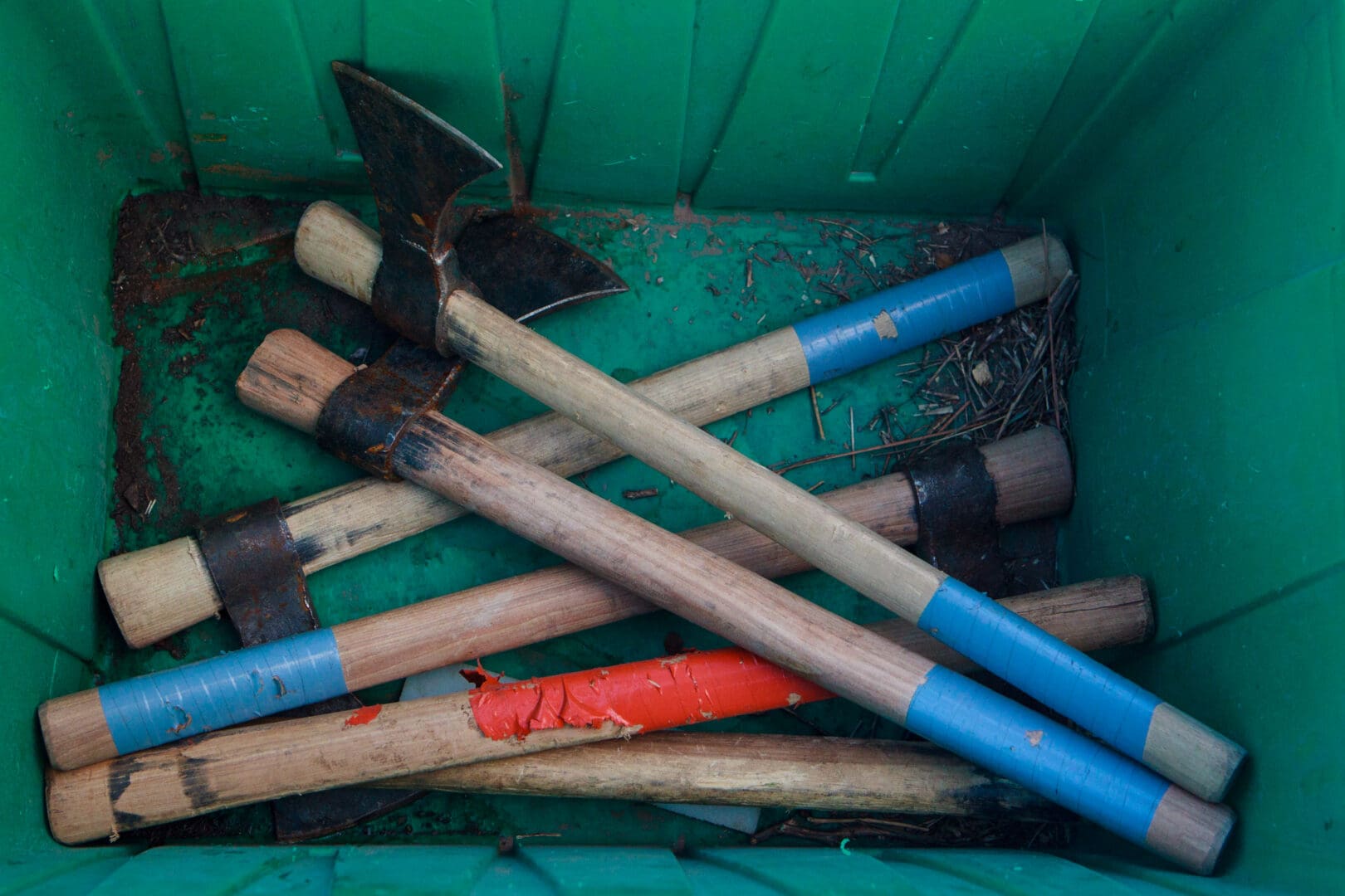 Green box of axes for throwing practice.