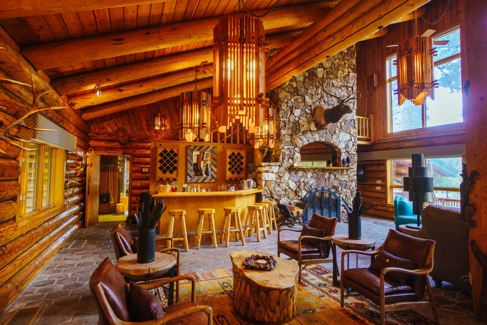 Inside of a wooden, stone, western themed lodge.