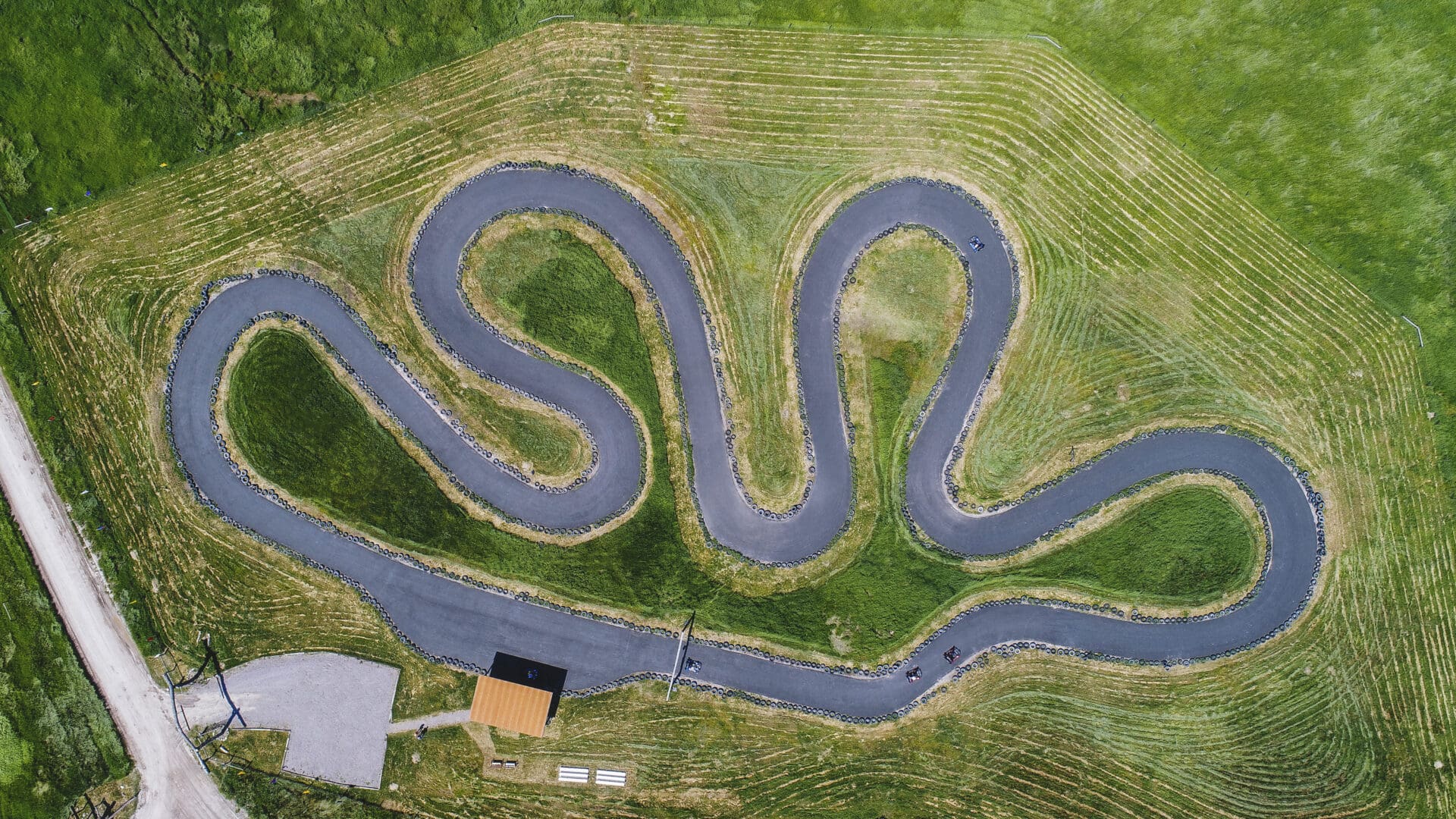 Overview shot of an outdoor go-kart race track.