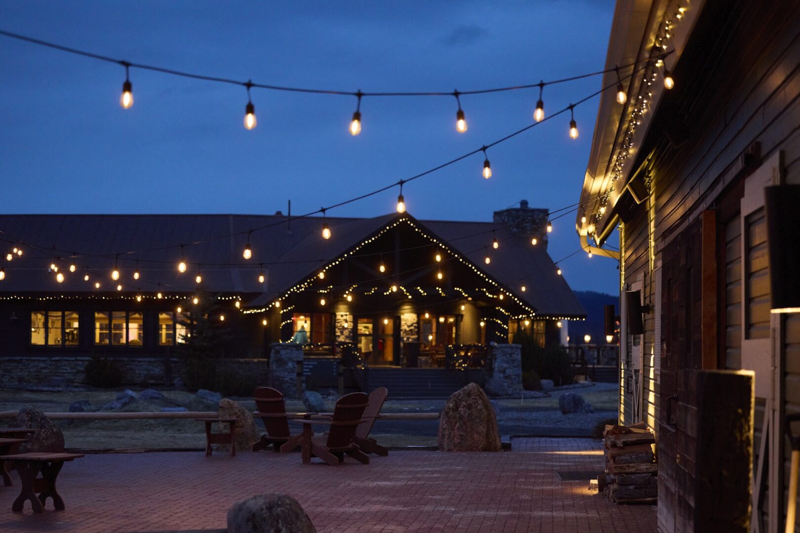 A darkly lit building with string lights set up.