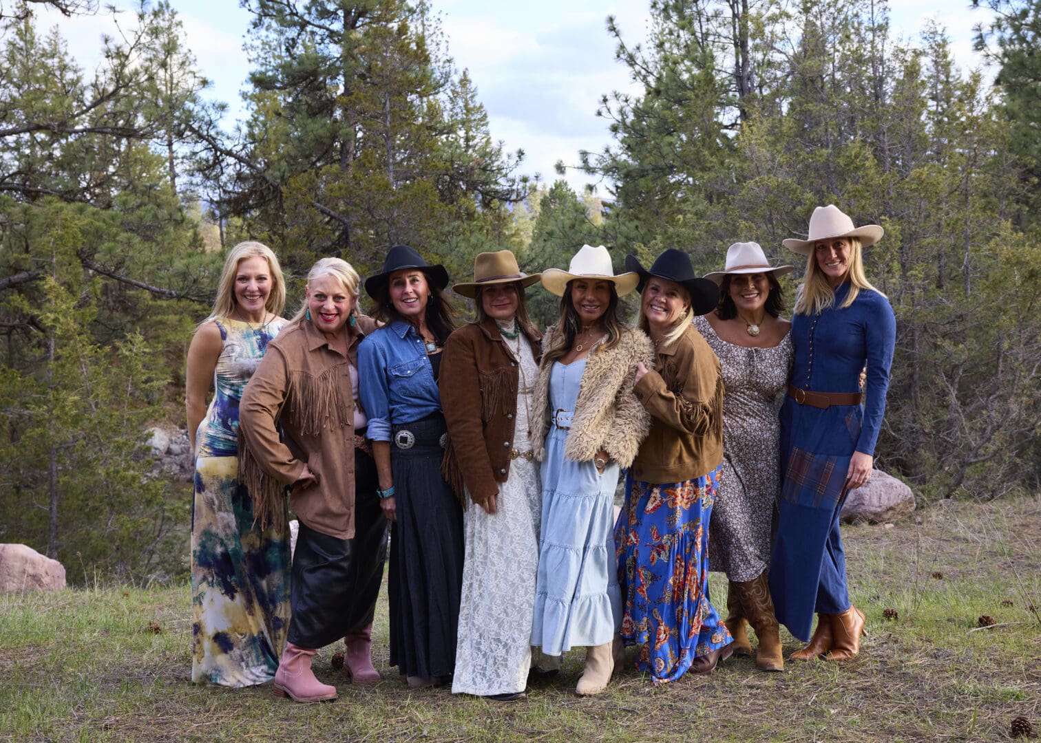 Group of women wearing western style clothes posing together.