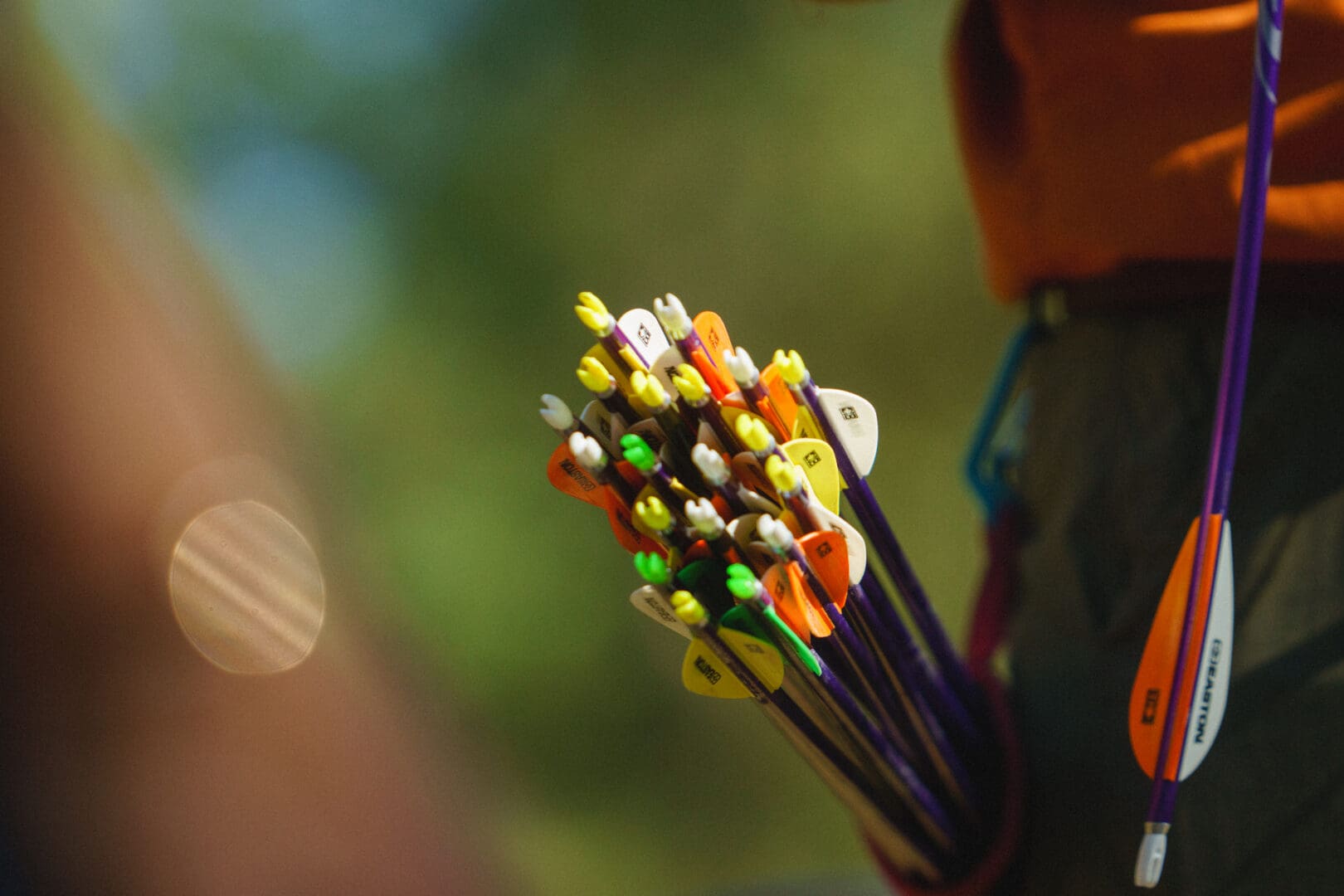 Arm notching a bow and arrow.