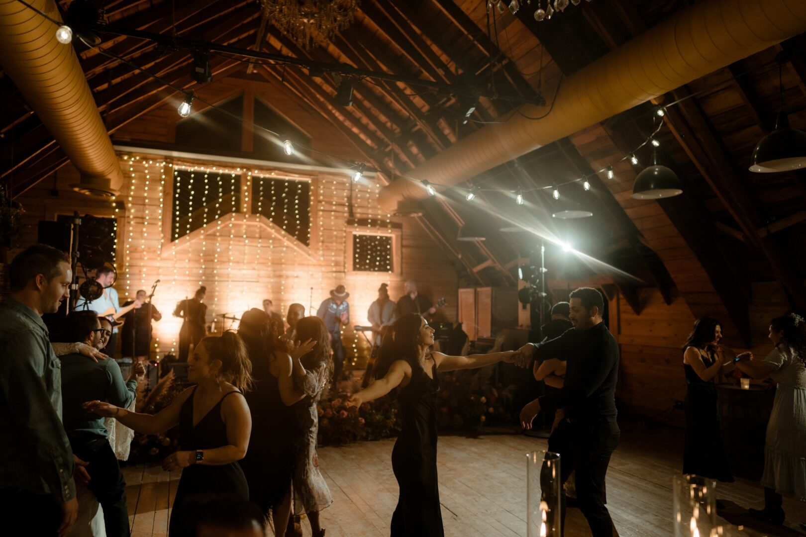 People dancing inside at a western entertainment area.