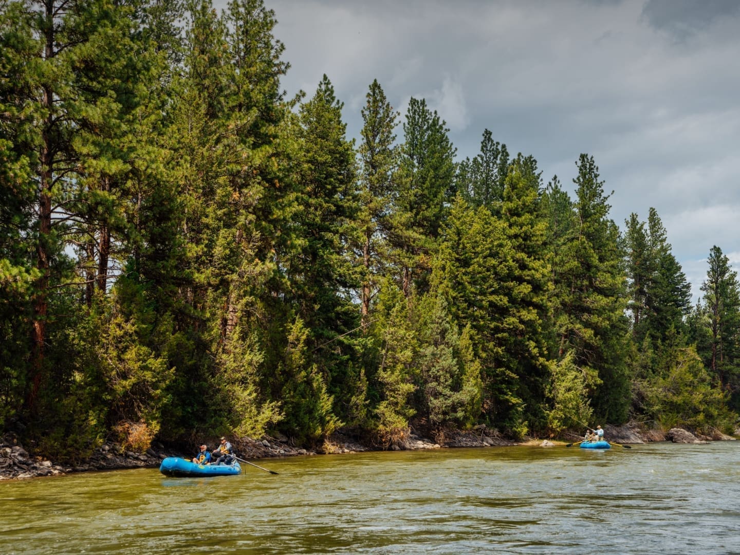 Wide view of two rafts floating down the Blackfoot River