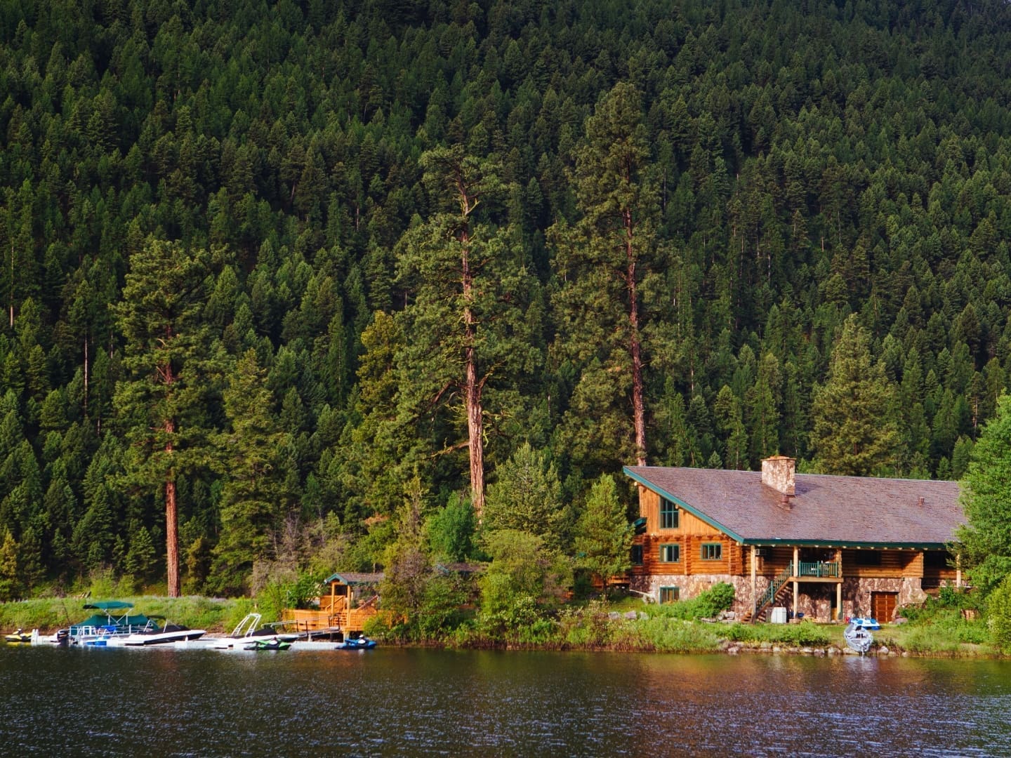 Log cabin on a lake island in the summer
