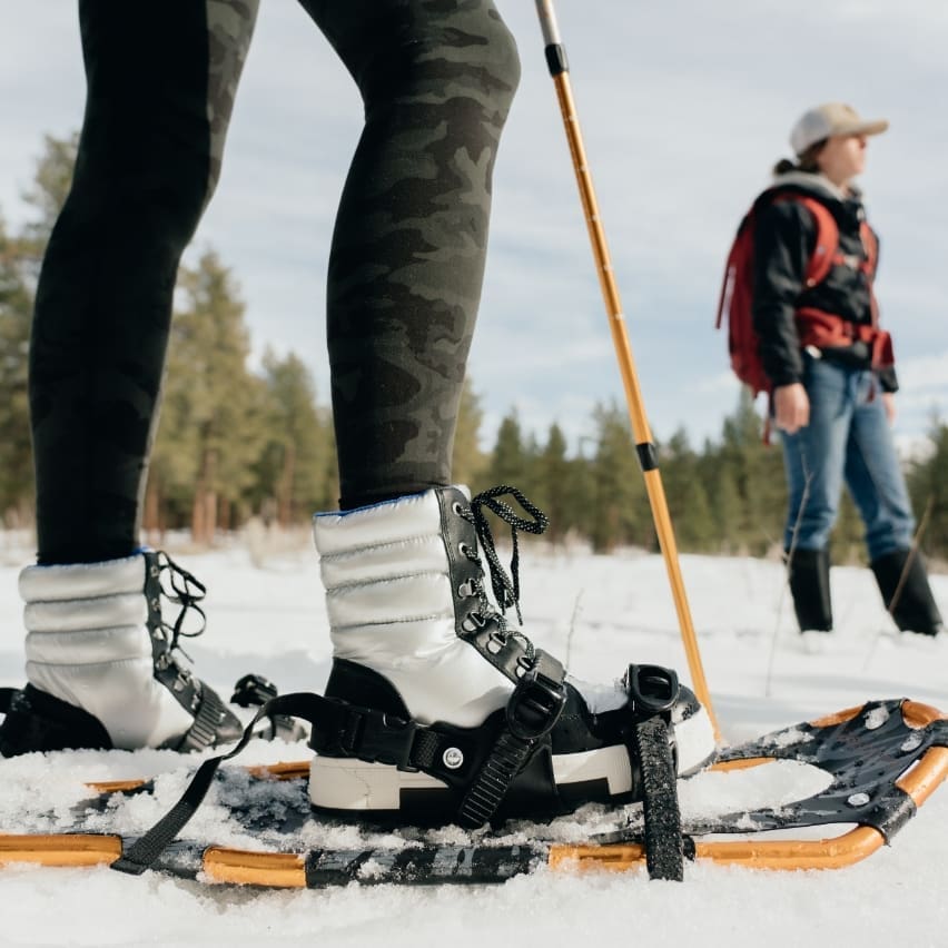 Pair of snowshoes on a hiker's feet