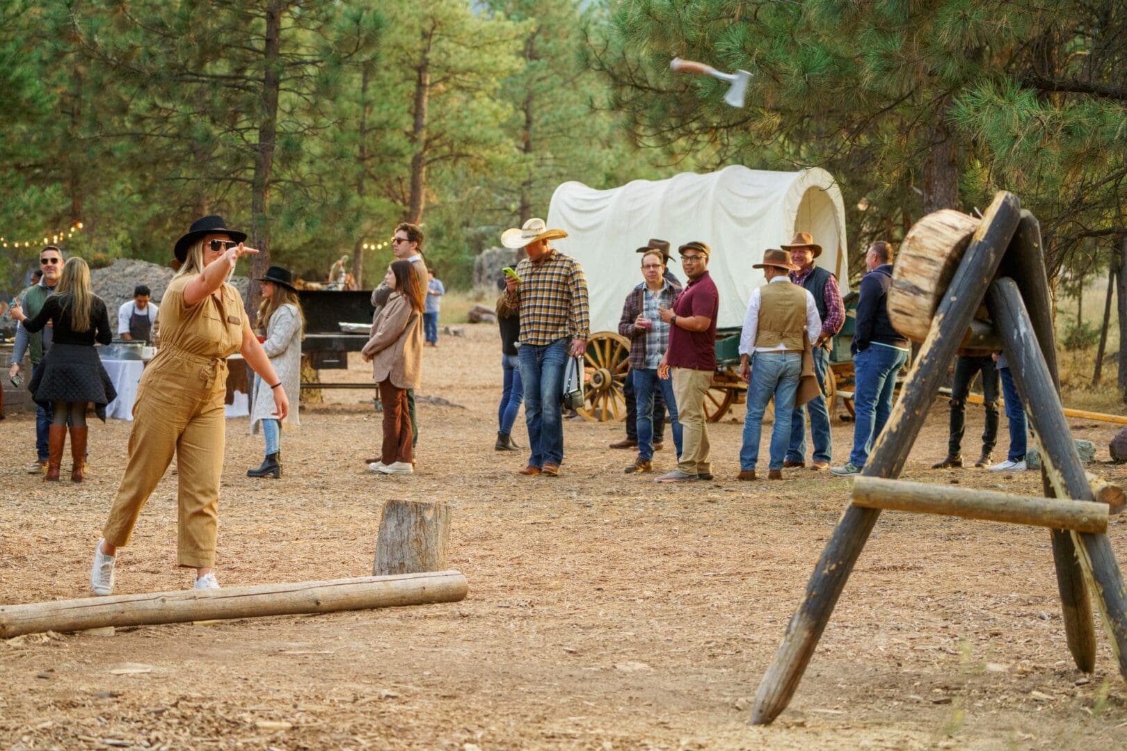 Guest throwing an axe at the Chuck Wagon dining experience at Paws Up