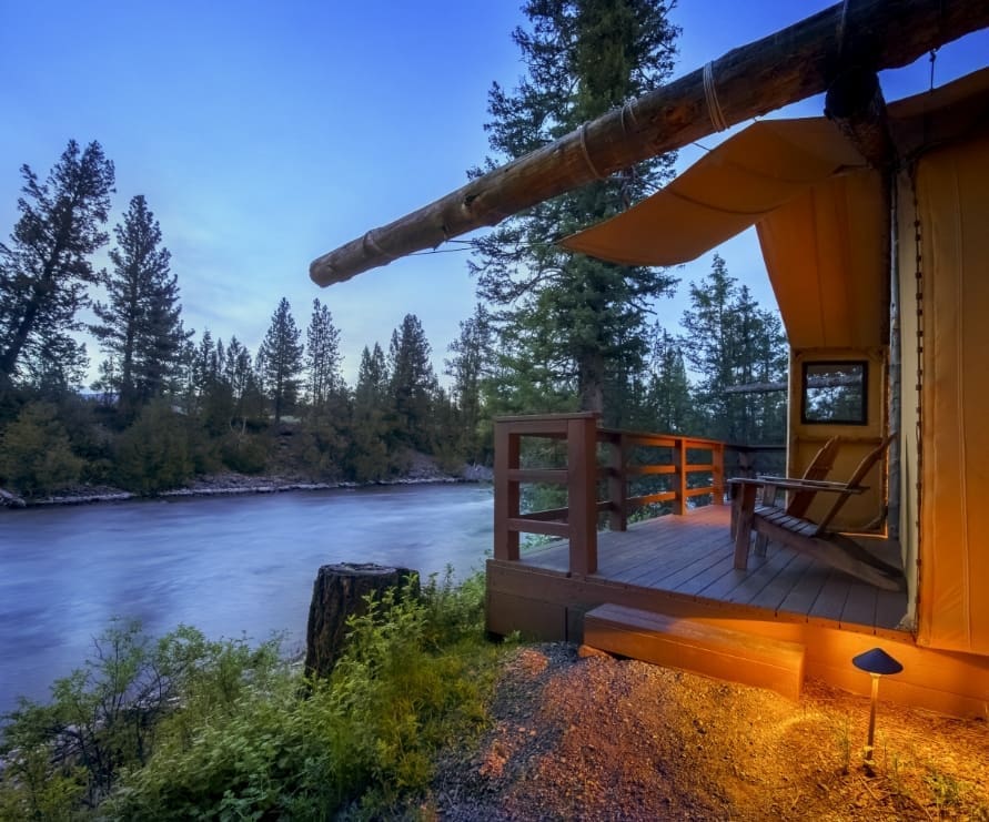 Side shot of a glamping tent balcony along the Blackfoot River