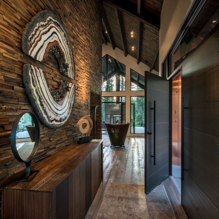 Hallway shot of Light Haus in Green O, showing the front door entryway and stone wall in the hall
