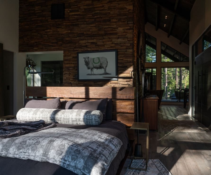 Bedroom in Light Haus in Green O, featuring a king bed with a dark gray comforter