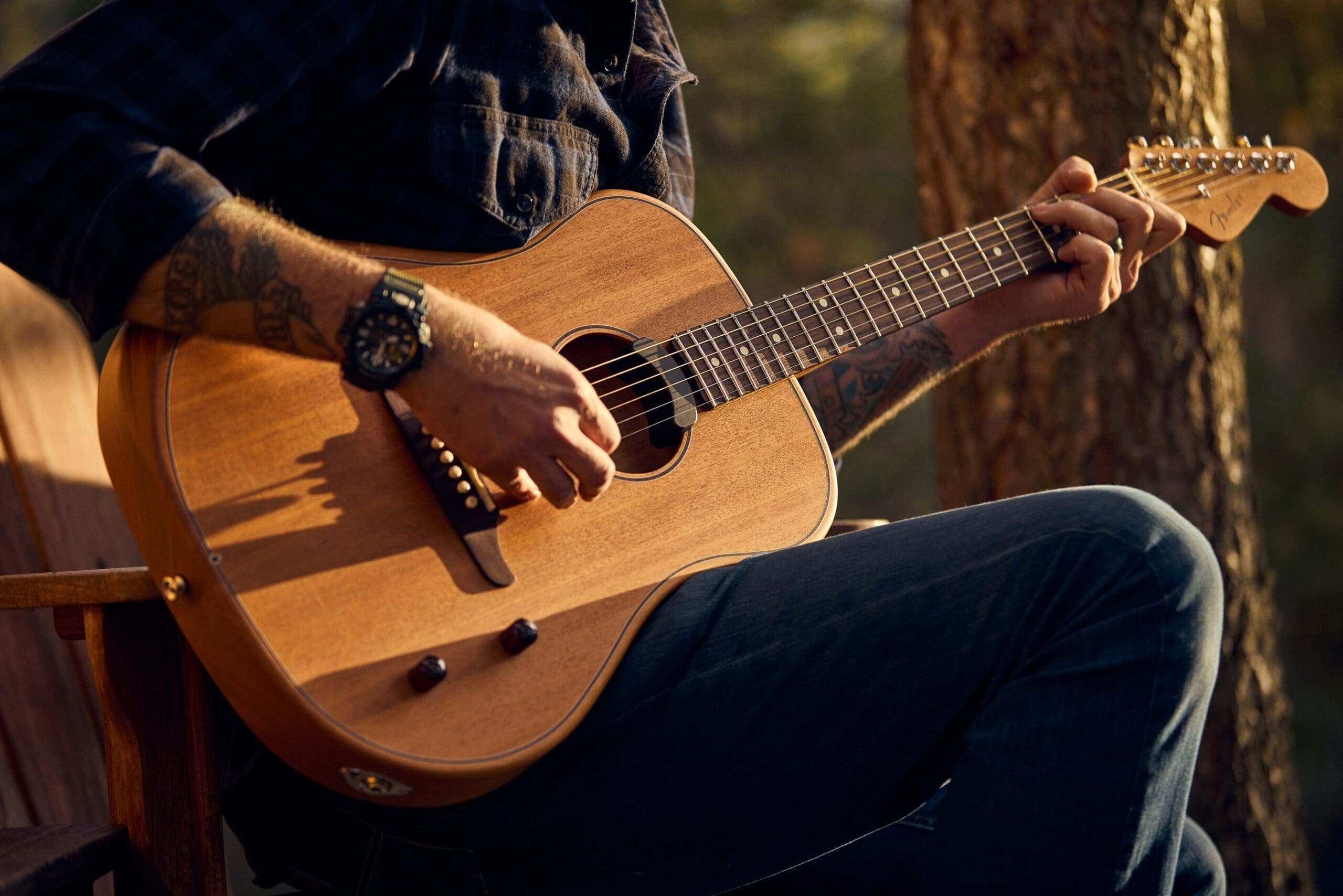 Man playing an acoustic guitar