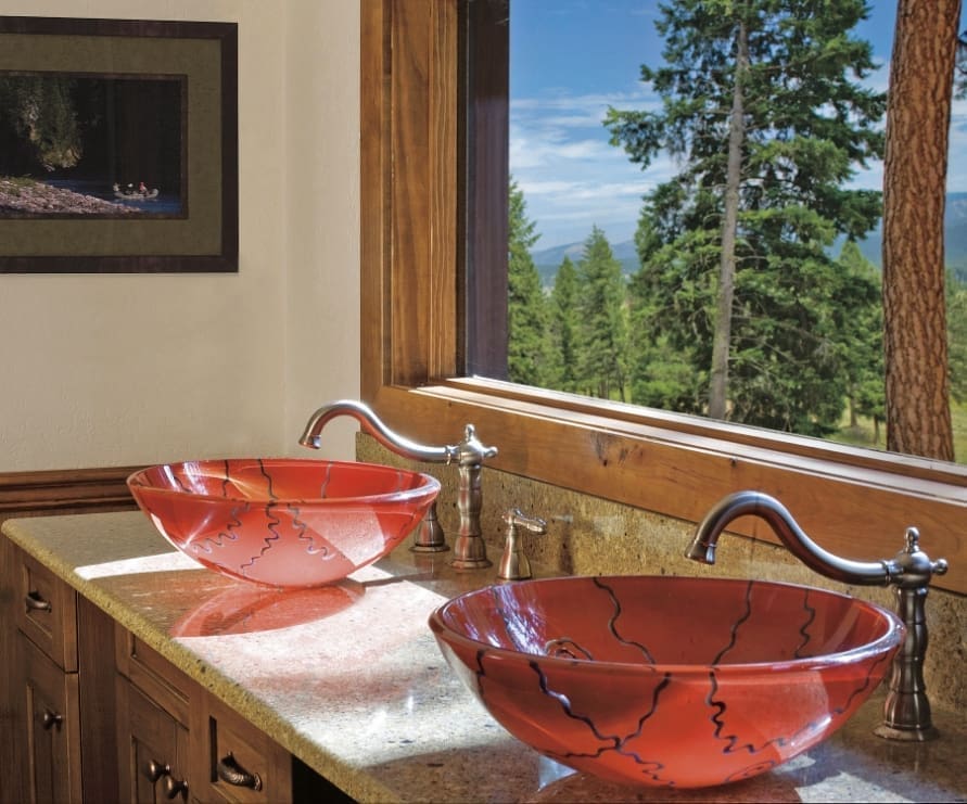 Inside view of a bathroom inside a Wilderness Estate, with a mountain view out of the window