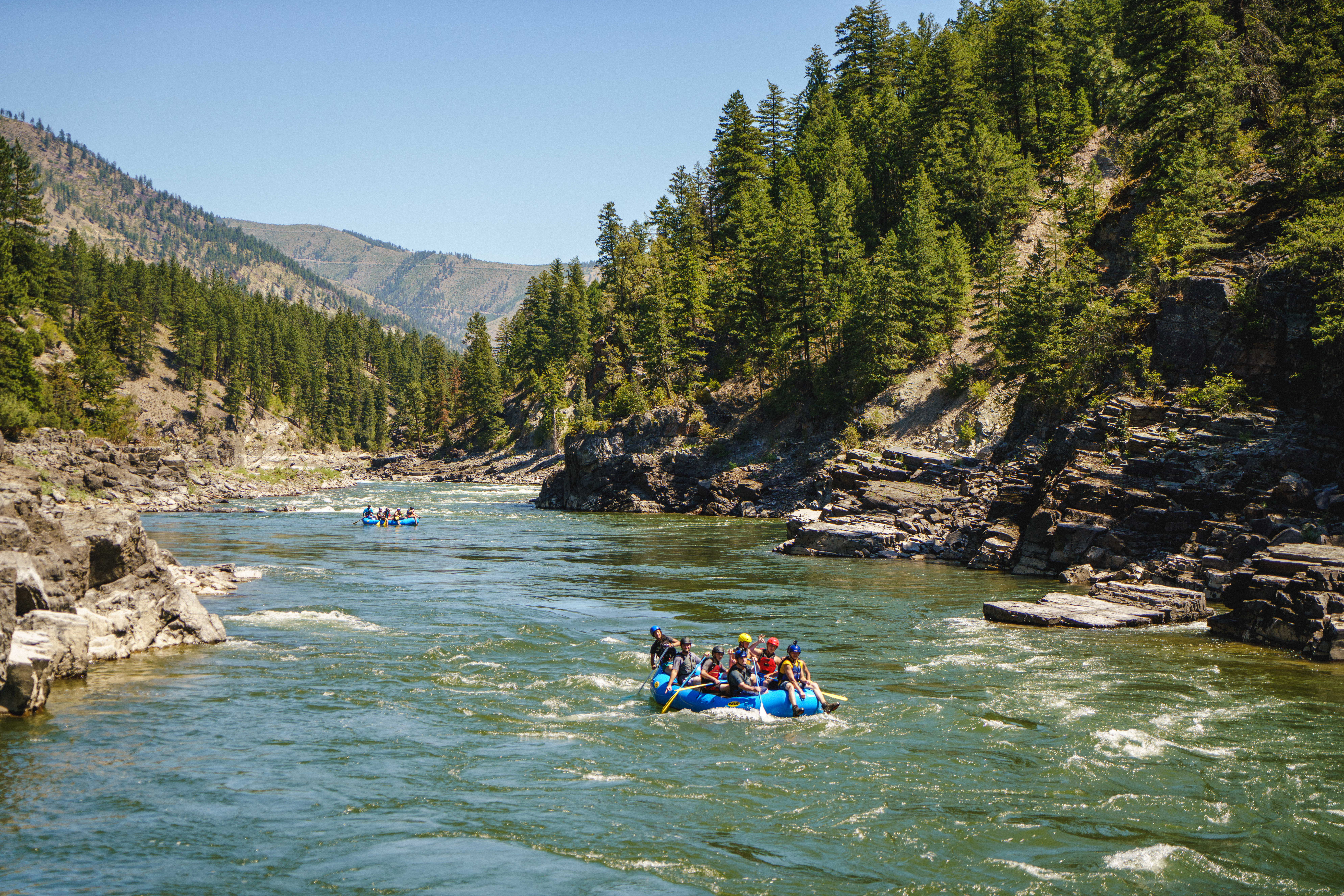 Group white water rafting in the Blackfoot River | Paws Up | Horseback riding & Fly Fishing in Montana