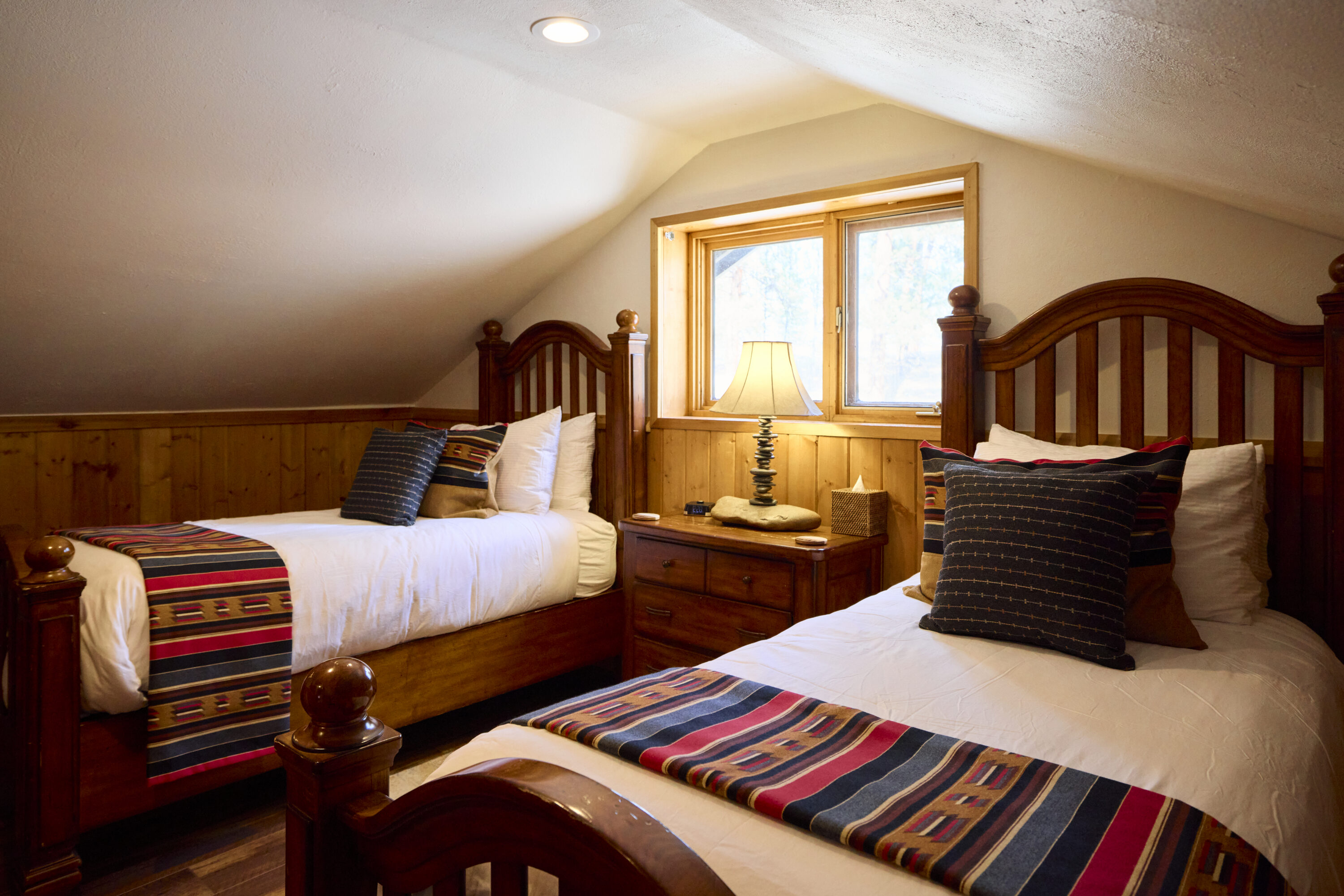 Western designed bedroom with twin beds.