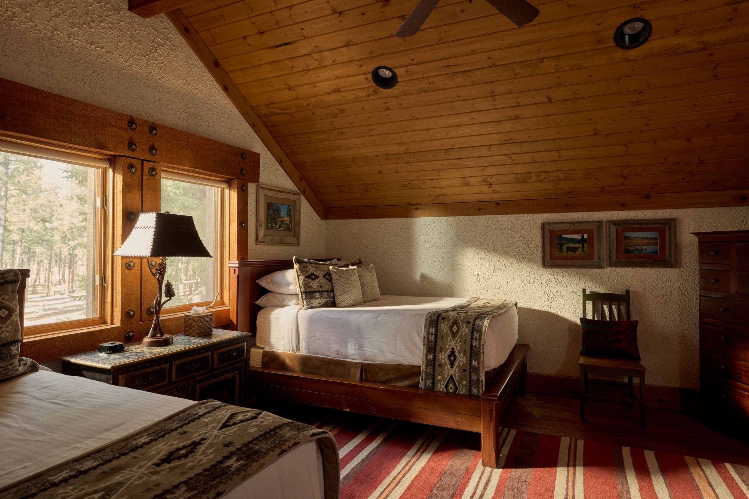 Two full beds in a cabin loft