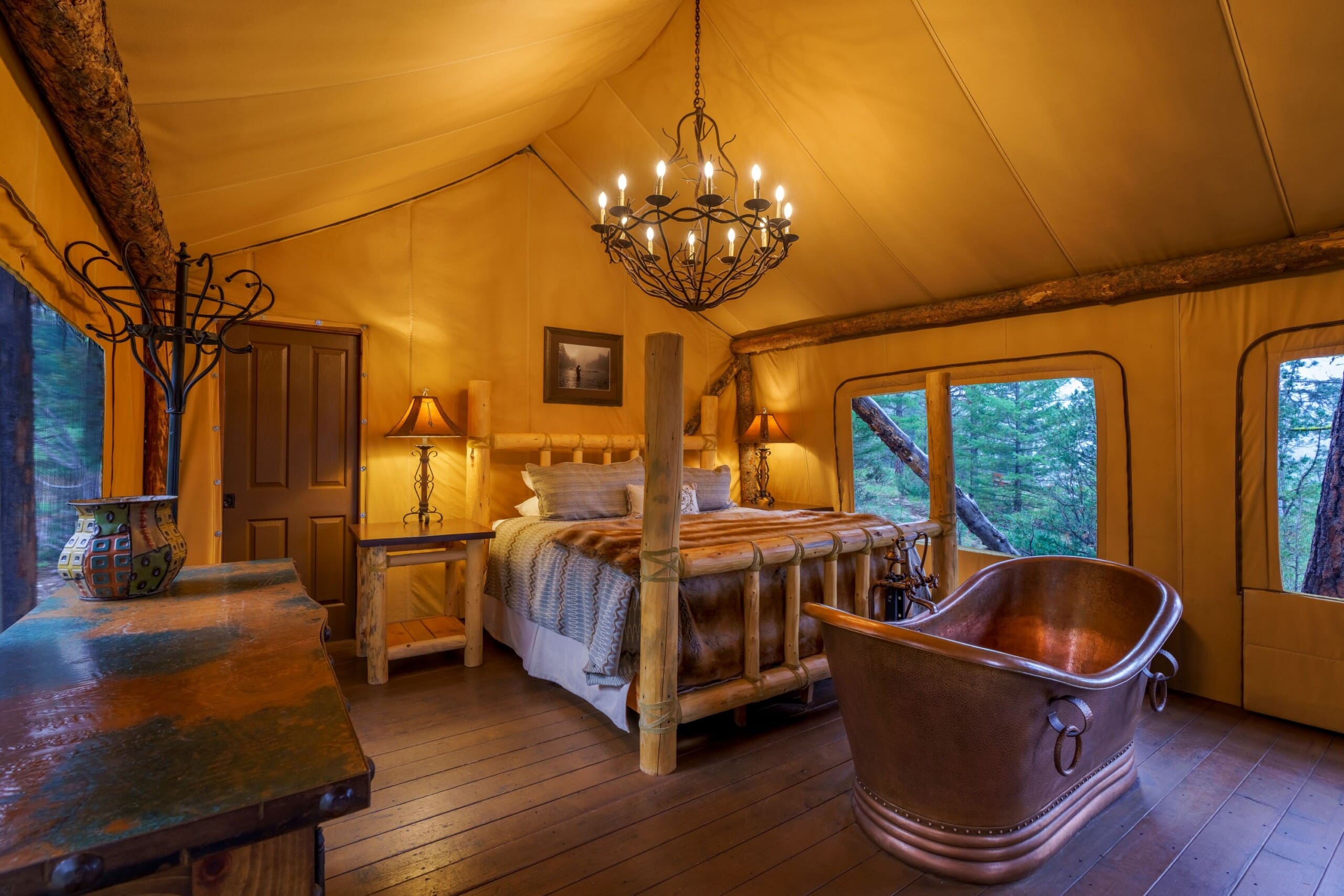 Interior of luxury glamping tent with king size bed