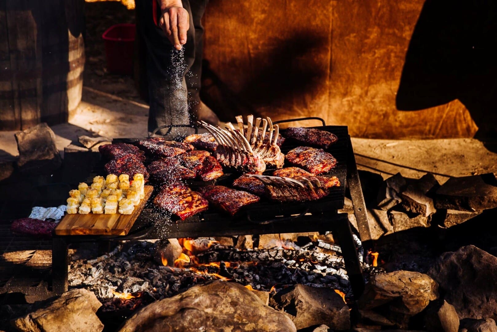 Ribs and meat cooking over an open flame