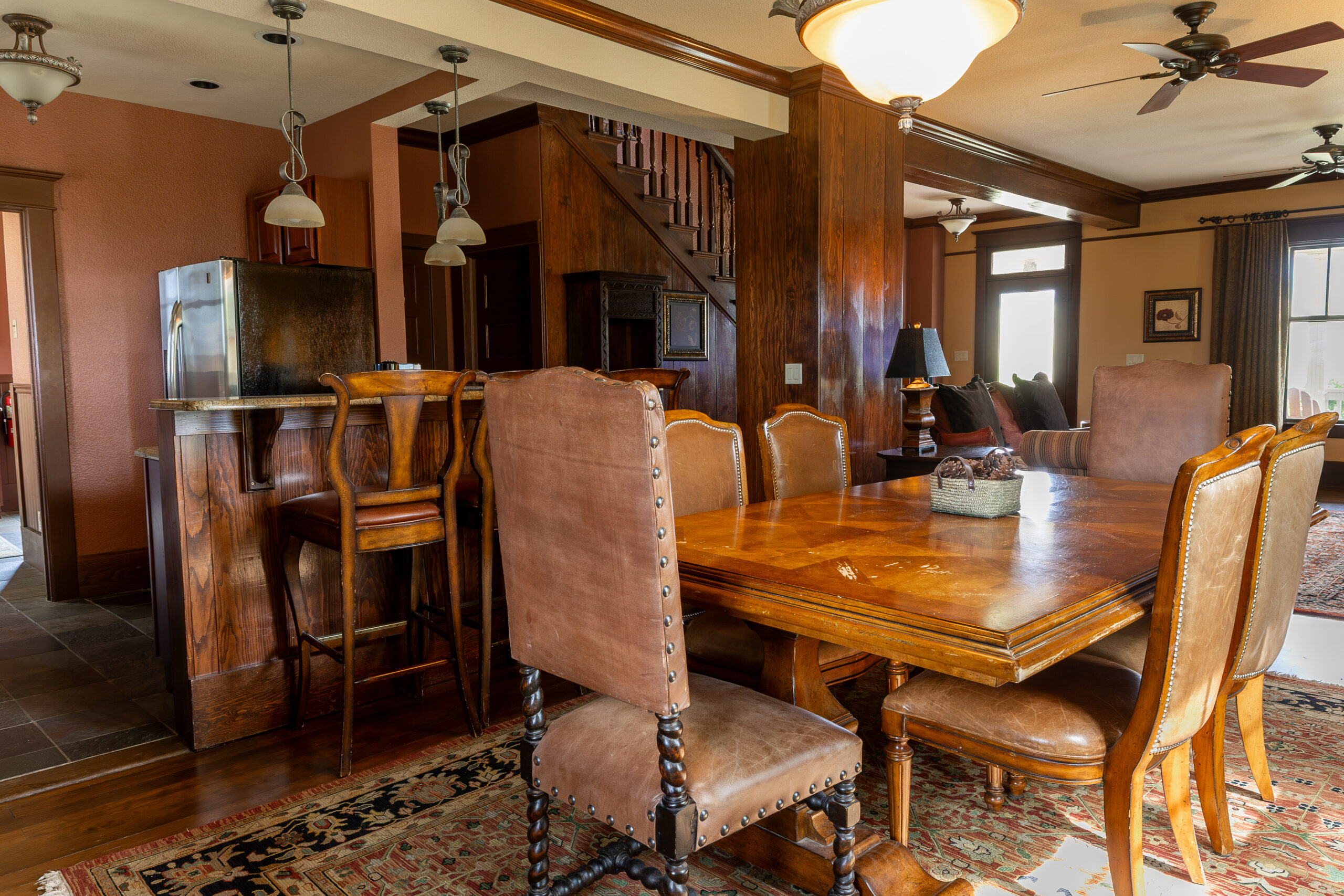 Western older style dining room with leather chairs and a wooden table.