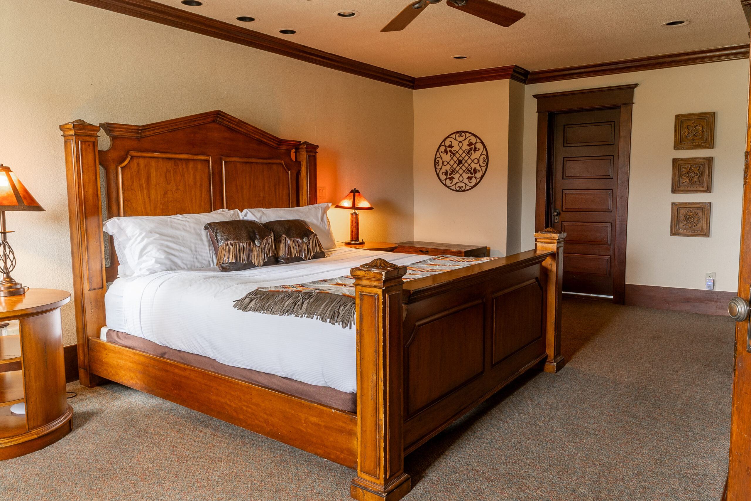 Western looking bedroom with a bed on a wooden platform.