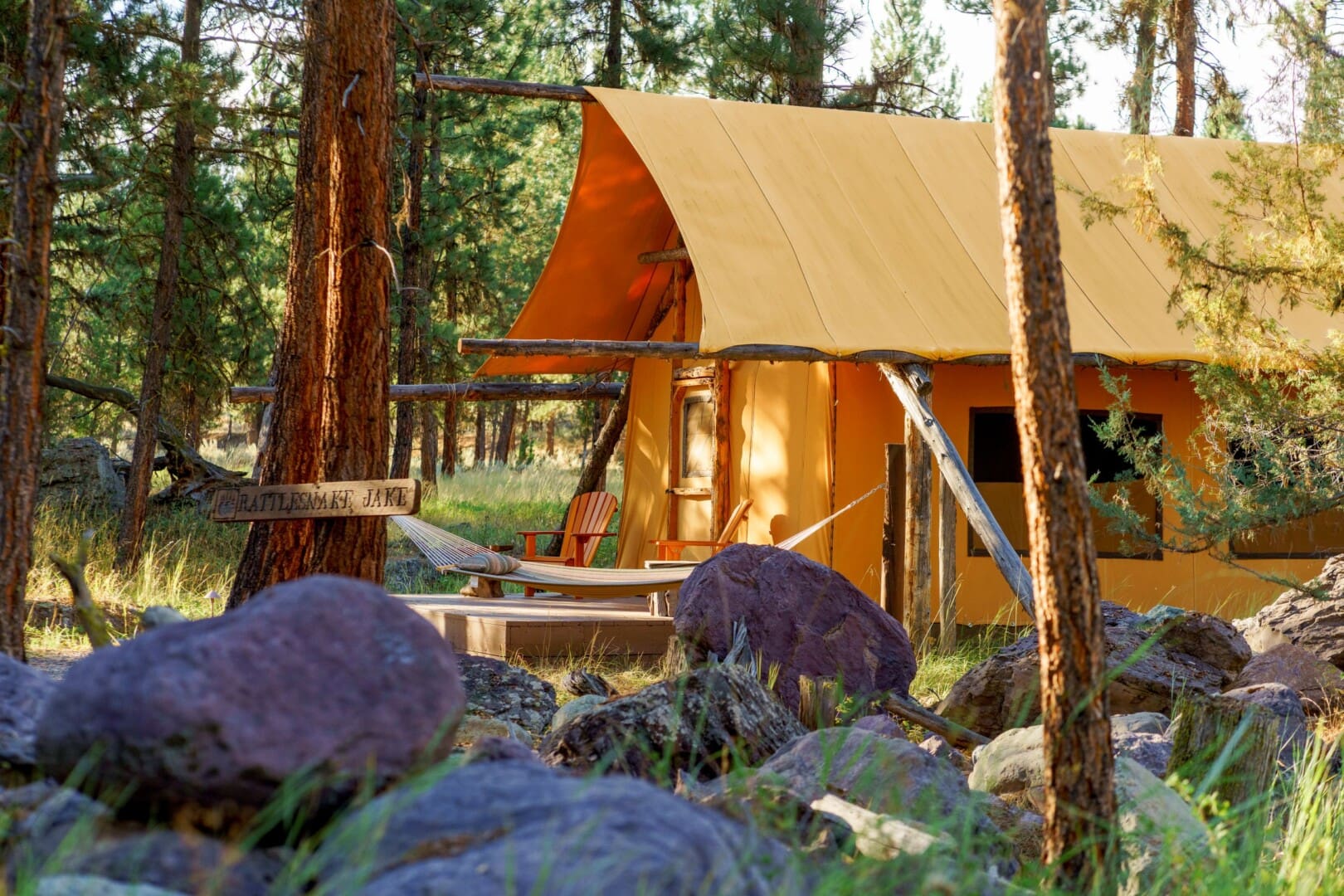 Outside of canvas glamping tent in the woods