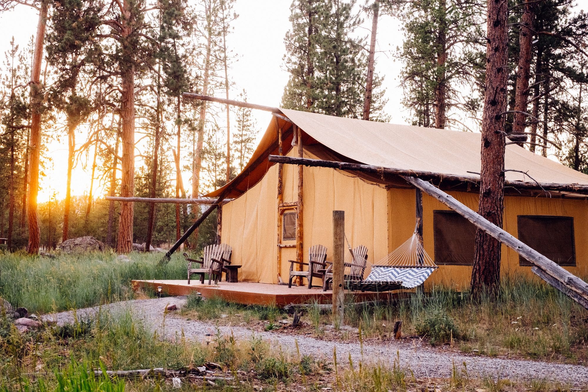 Exterior of a two bedroom glamping canvas tent in the forest