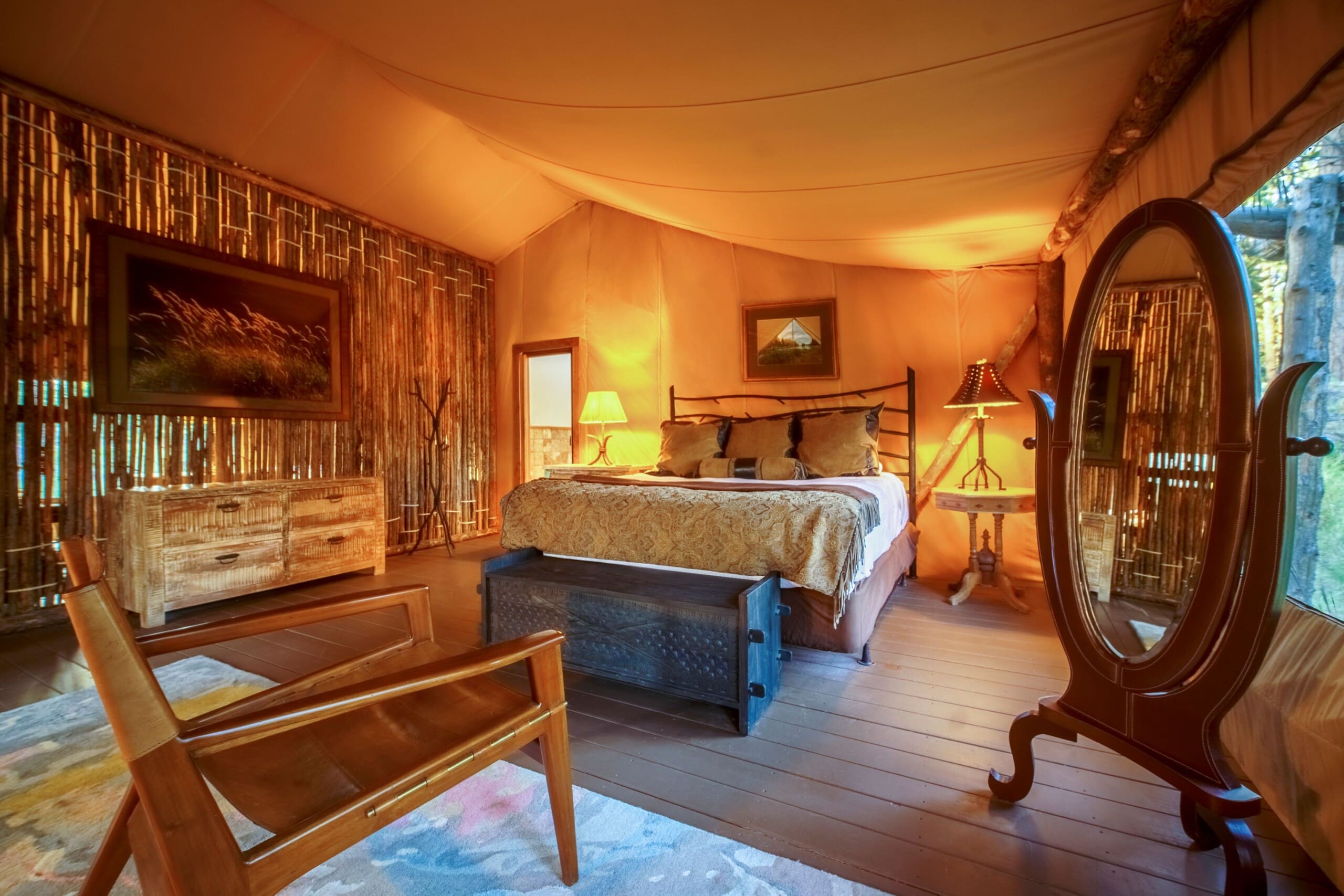 King bed inside a canvas glamping tent