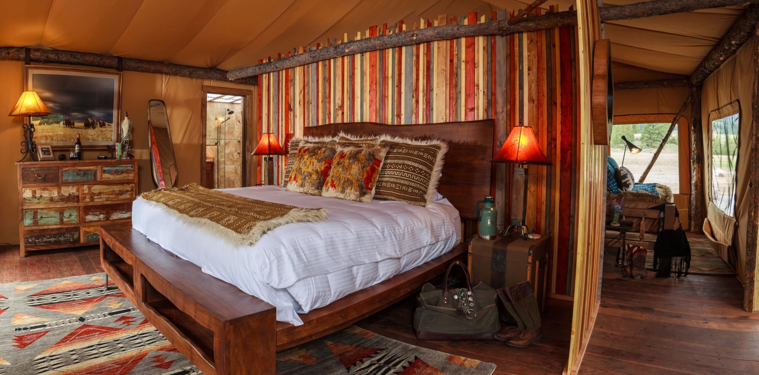 Western style luxury bedroom with king size bed inside glamping tent