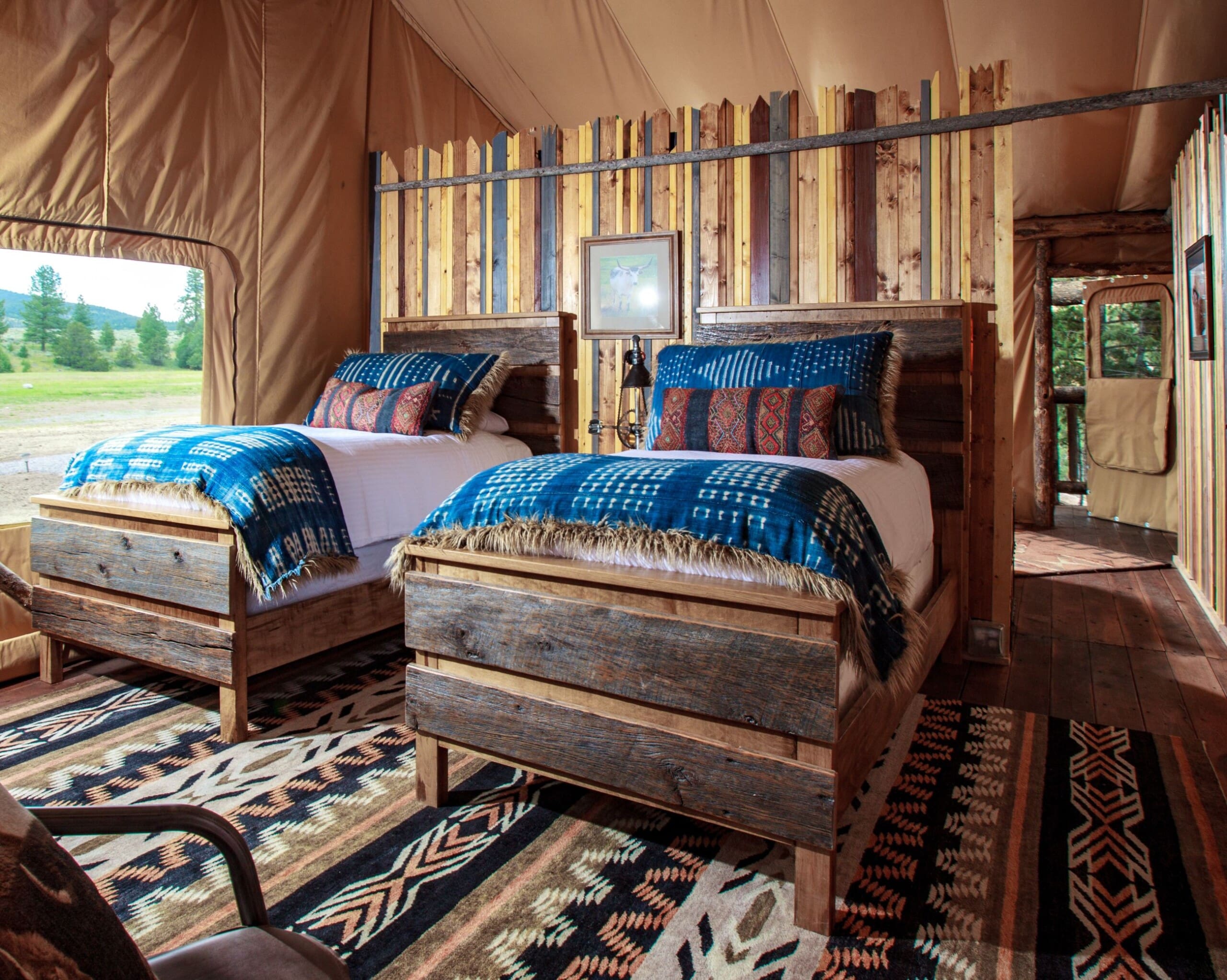 two full beds inside western style luxury glamping tent