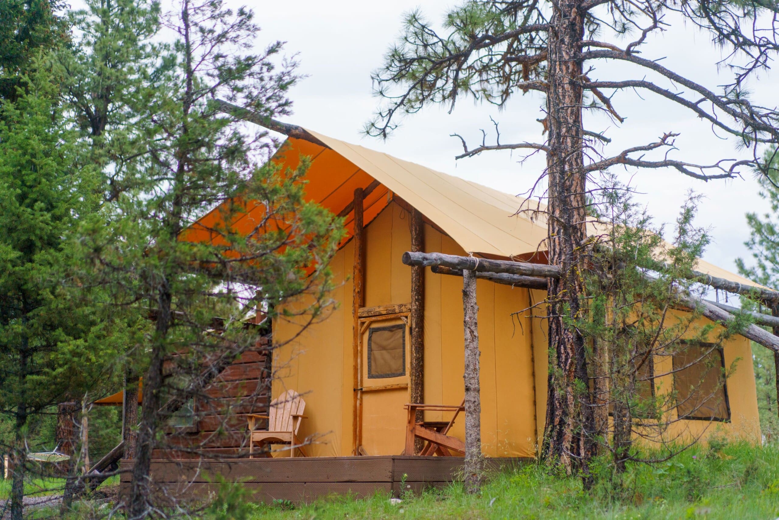 Outside of yellow canvas glamping tent