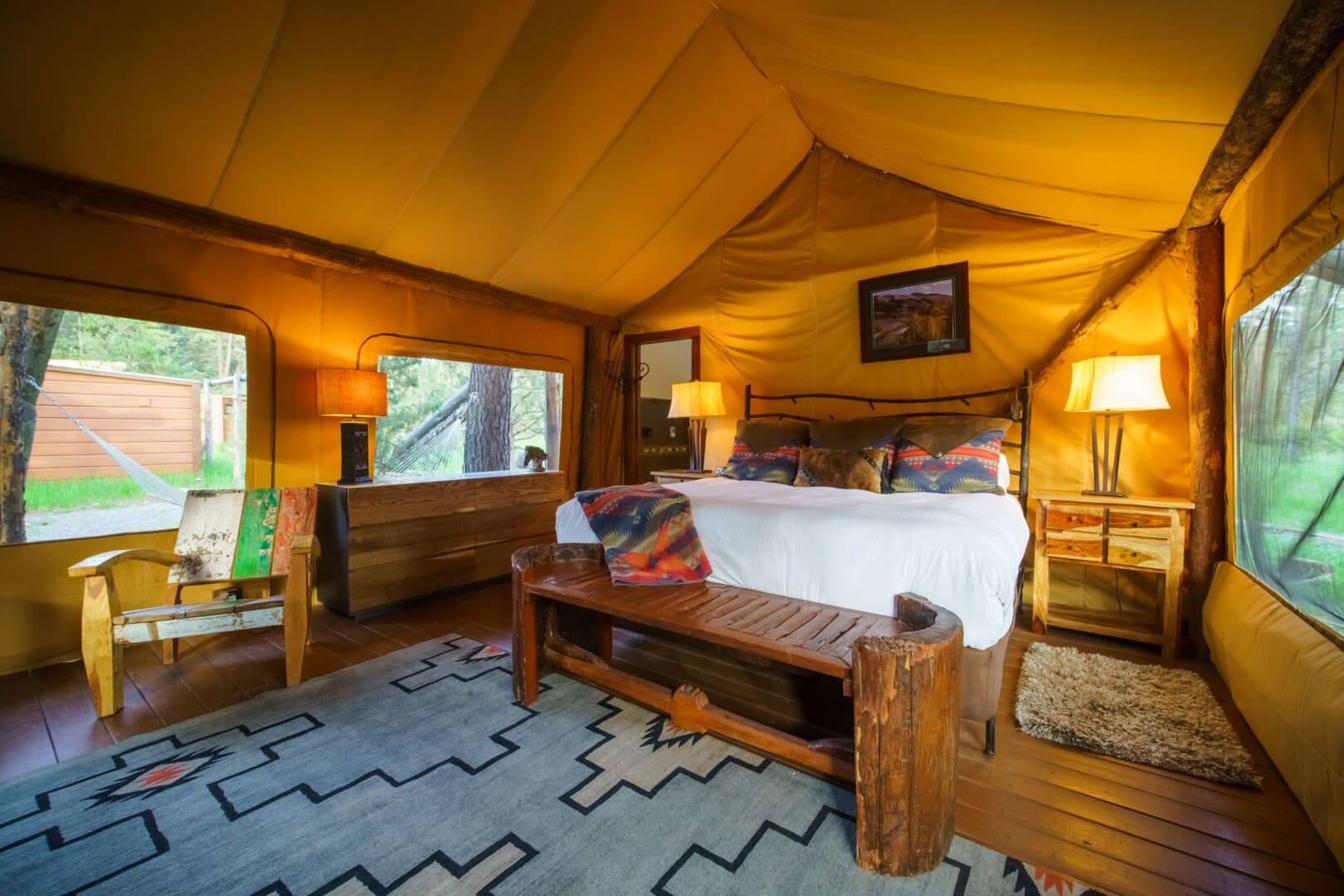 King size bed in a glamping tent
