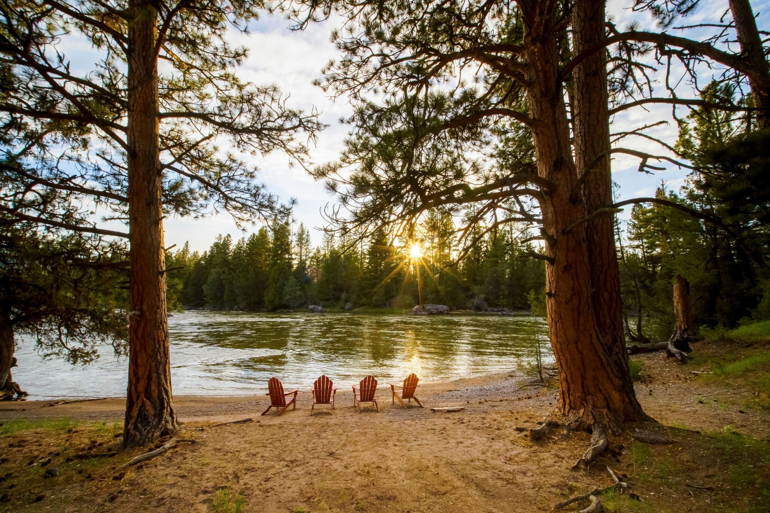 Chairs sitting on a river beach