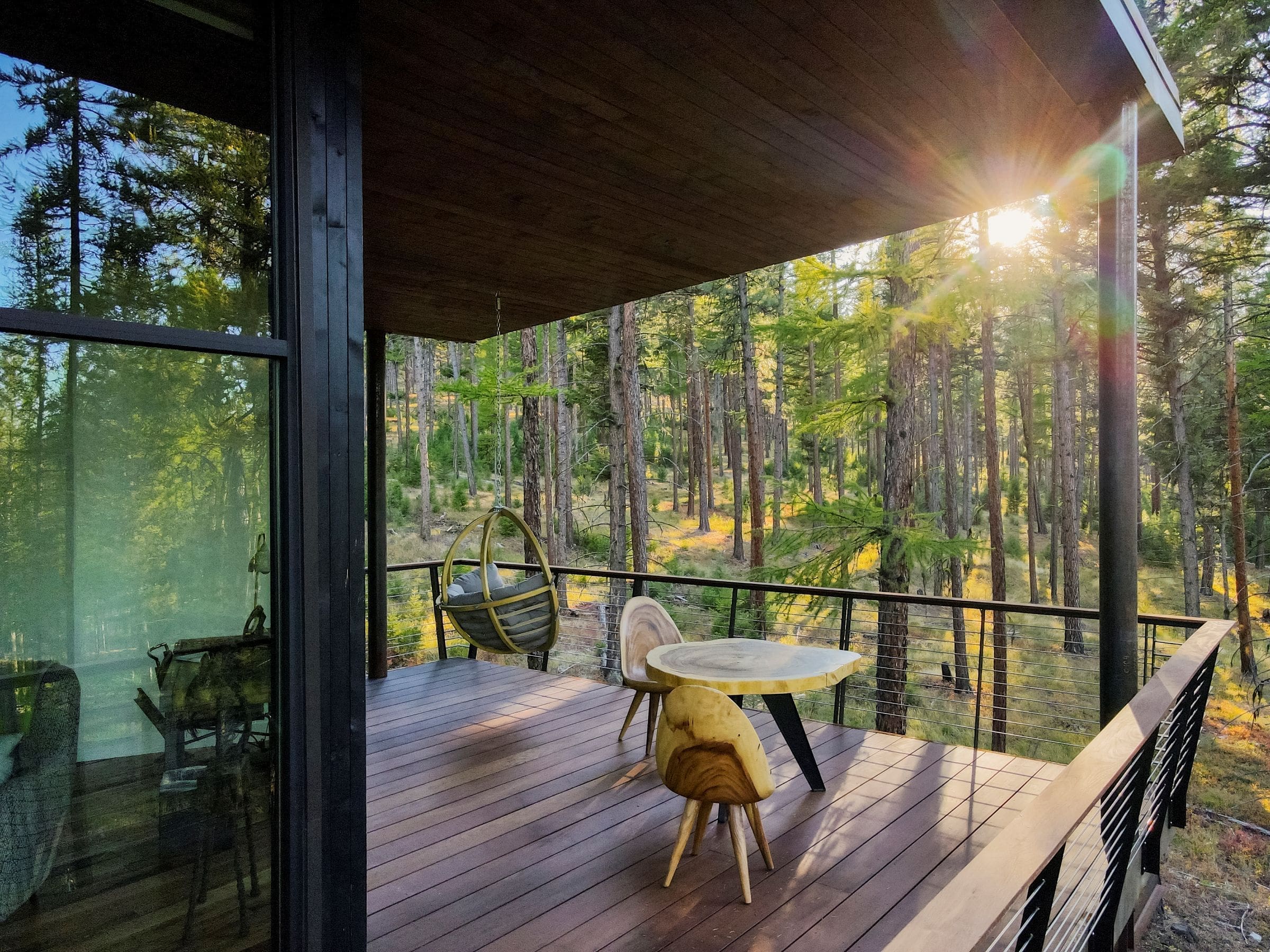 Modern balcony of treehouse cabin in forest