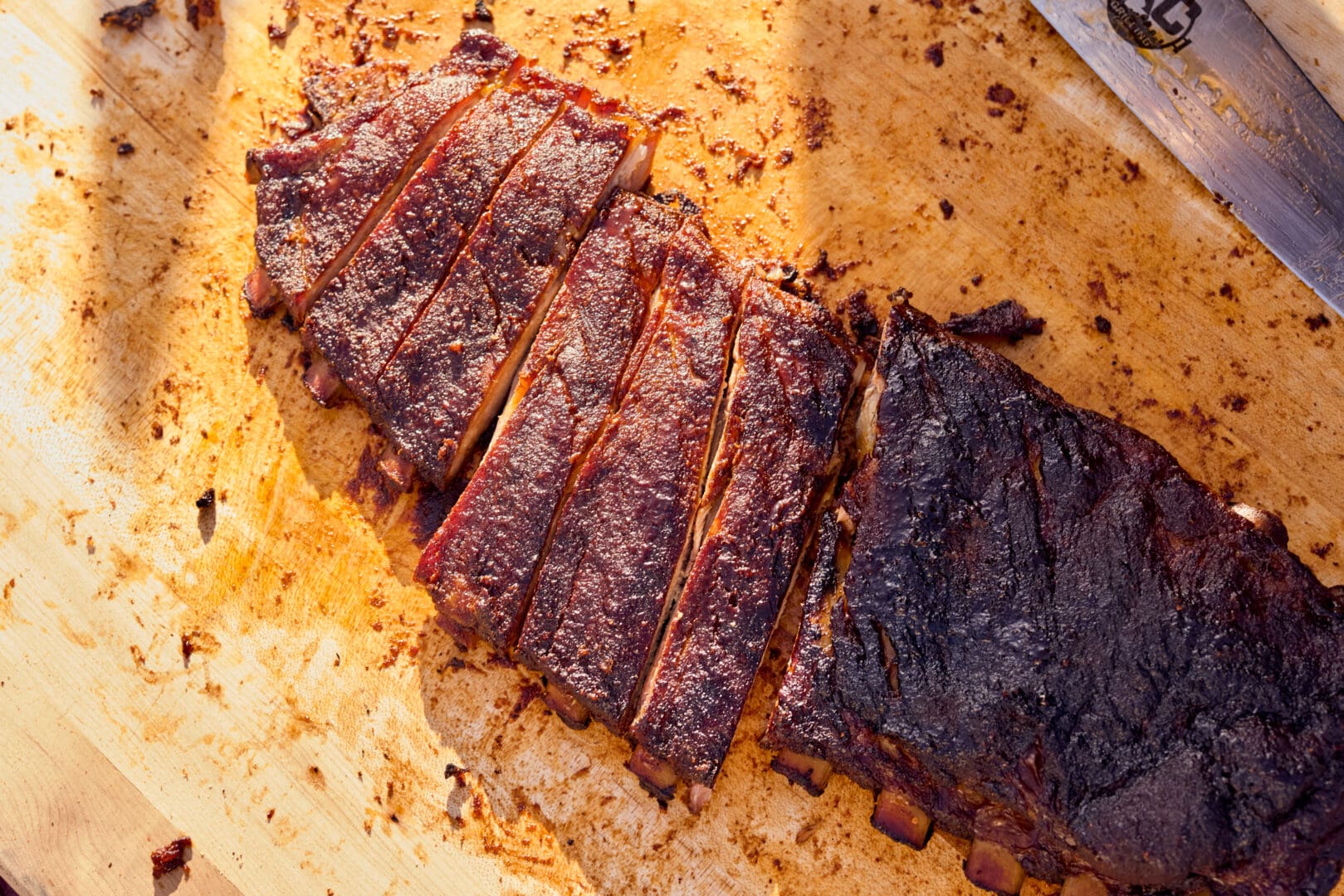 Overview shot of sliced meat on a cutting board.