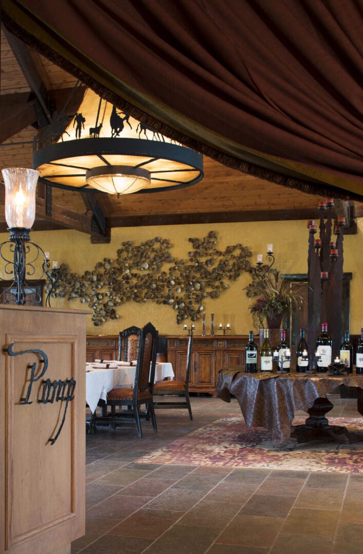 Restaurant with a sign stating "Pomp" and western themed walls and tables.
